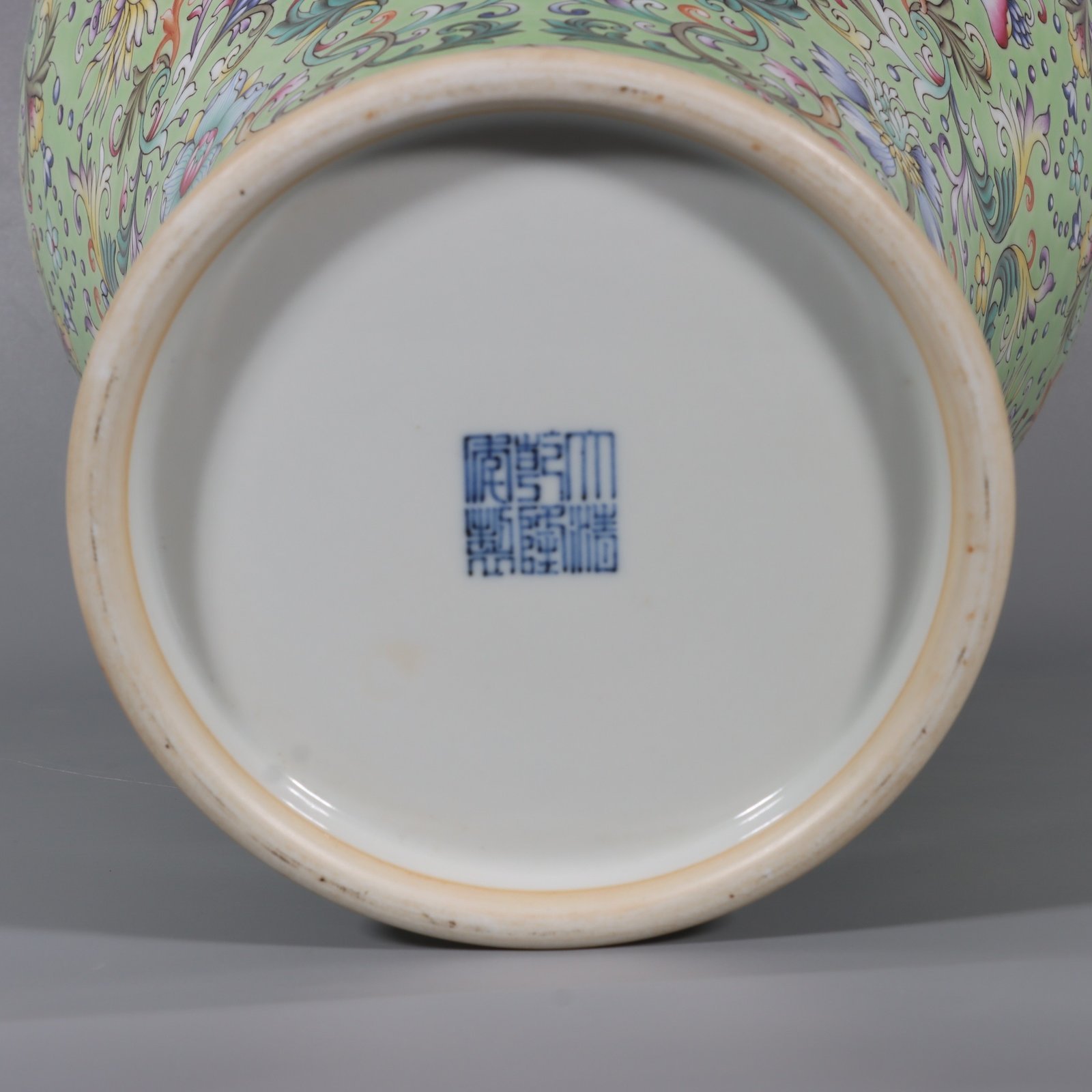 Qing Dynasty Qianlong pair of pastel turquoise and green ground lotus and plum vases