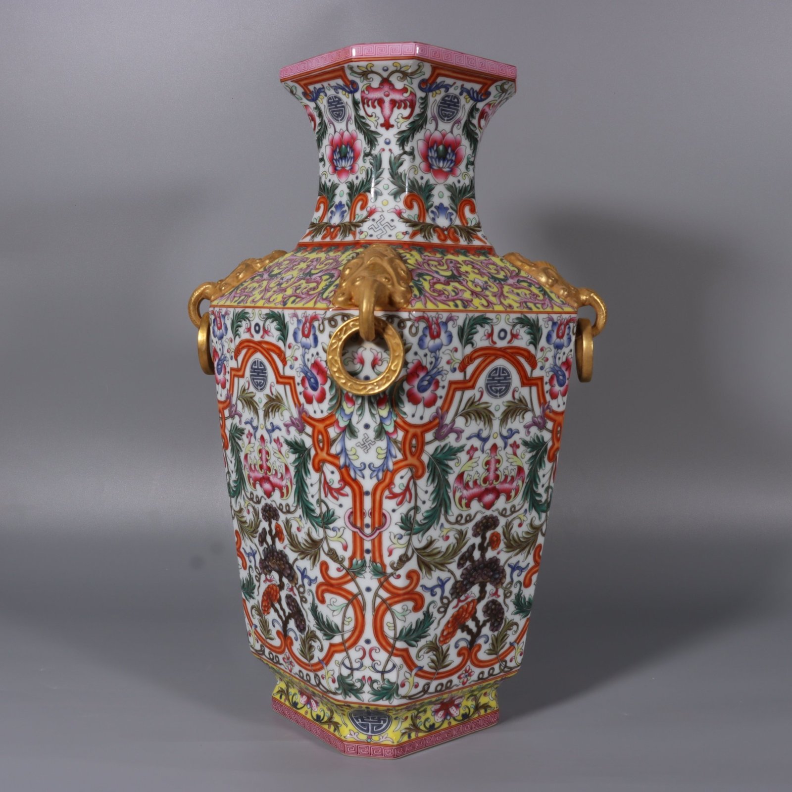 Qing Dynasty Qianlong white ground lotus lotus and lion ear square vase