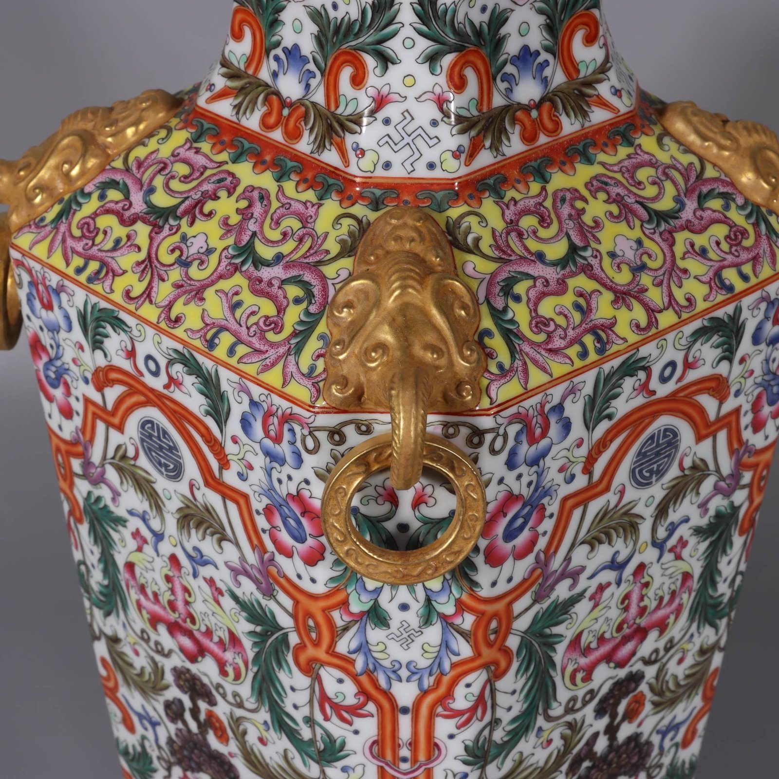 Qing Dynasty Qianlong white ground lotus lotus and lion ear square vase