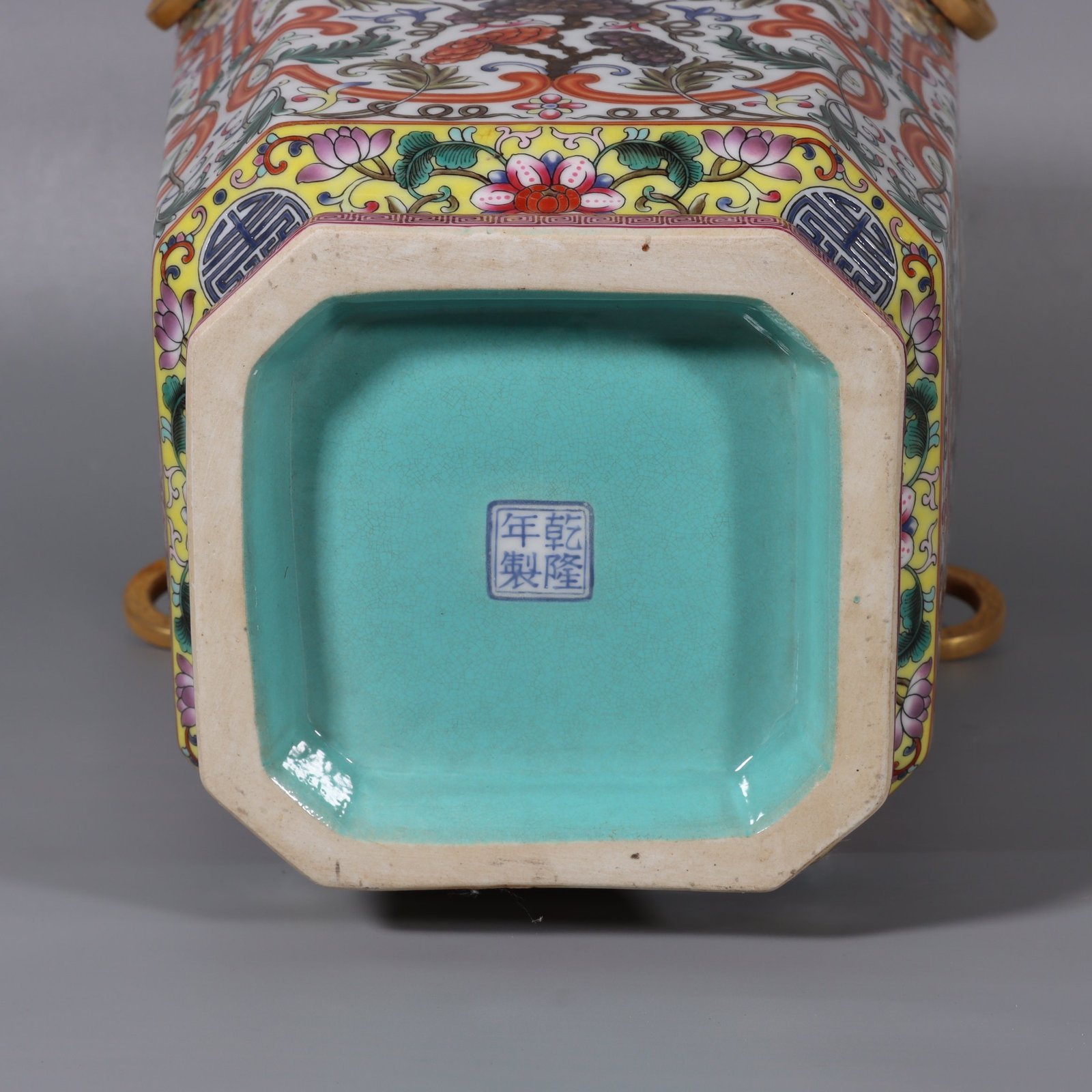 Qing Dynasty Qianlong white ground lotus lotus and lion ear square vase
