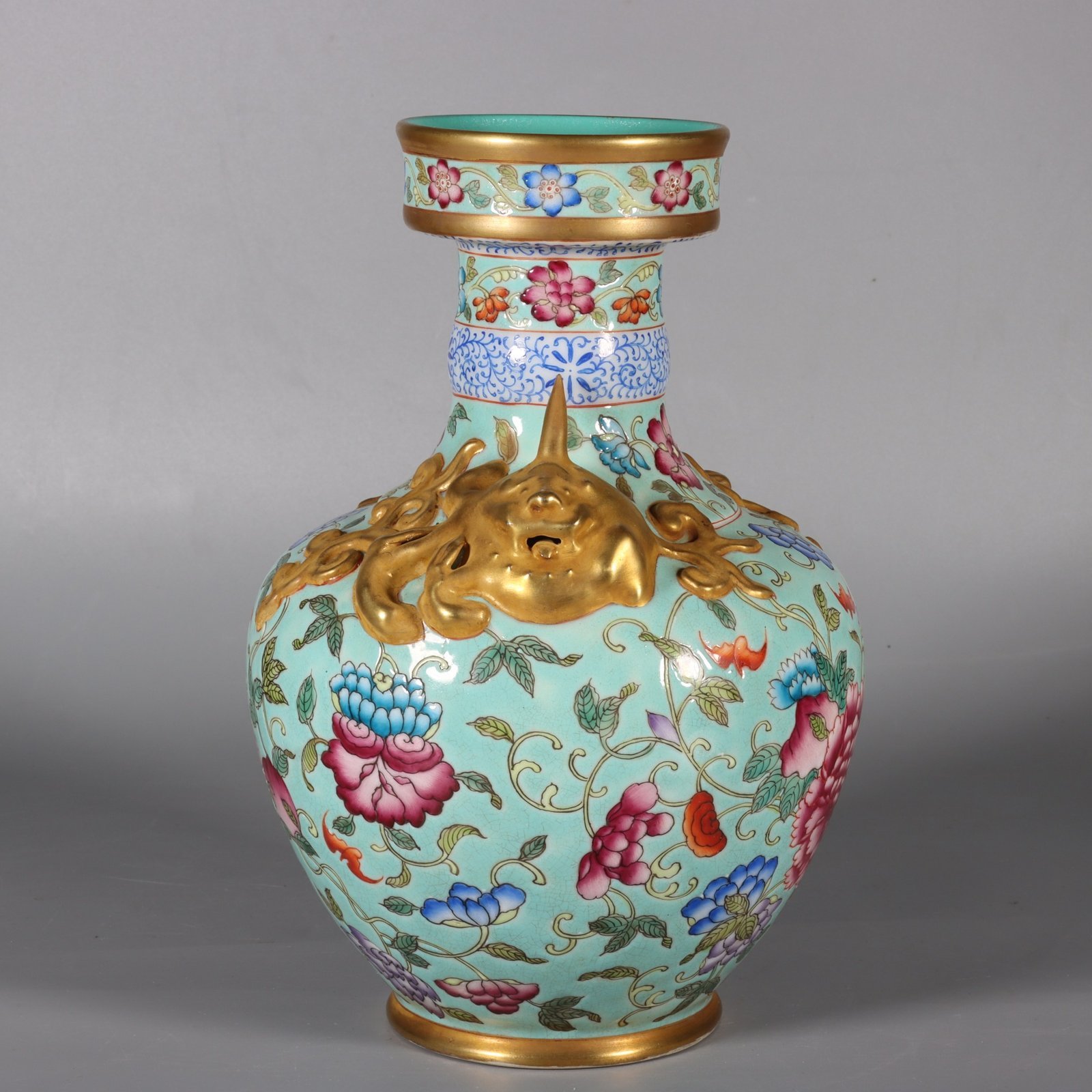 Qing Dynasty Qianlong pastel green lotus and animal ear vase