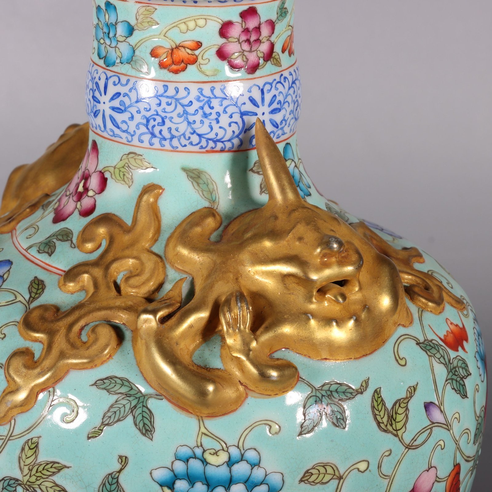 Qing Dynasty Qianlong pastel green lotus and animal ear vase