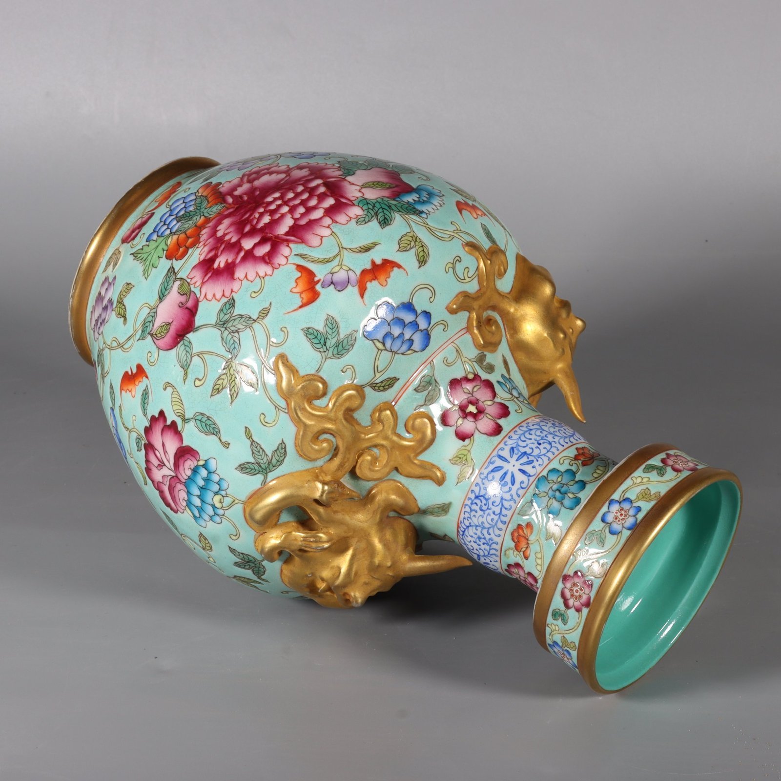 Qing Dynasty Qianlong pastel green lotus and animal ear vase