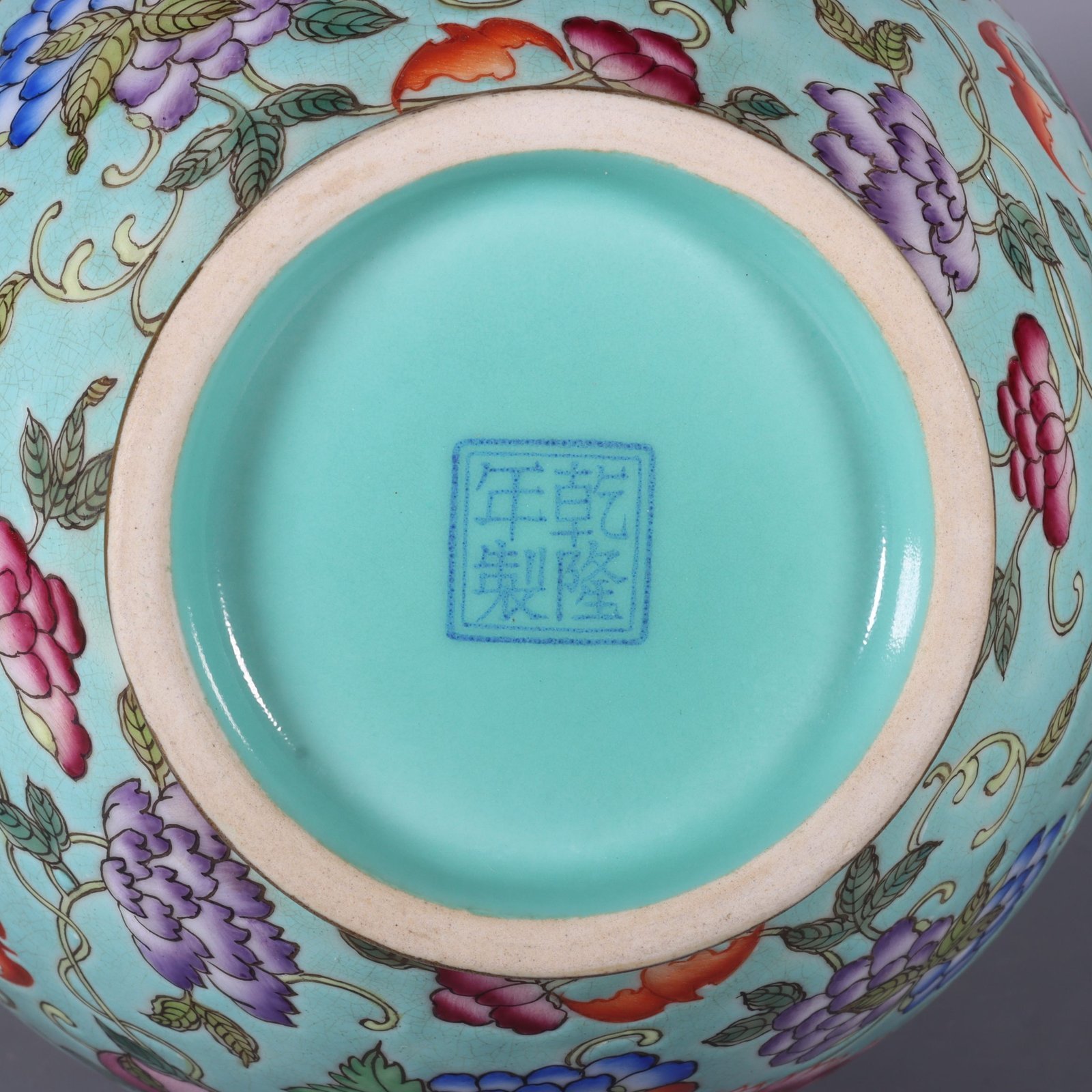 Qing Dynasty Qianlong pastel green lotus and animal ear vase