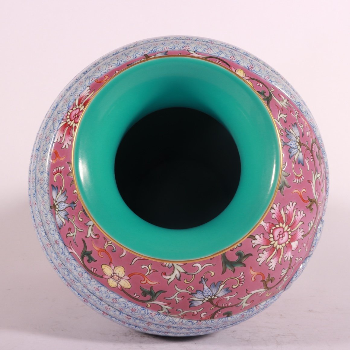 Qing Dynasty Qianlong pastel rouge red ground lotus vase