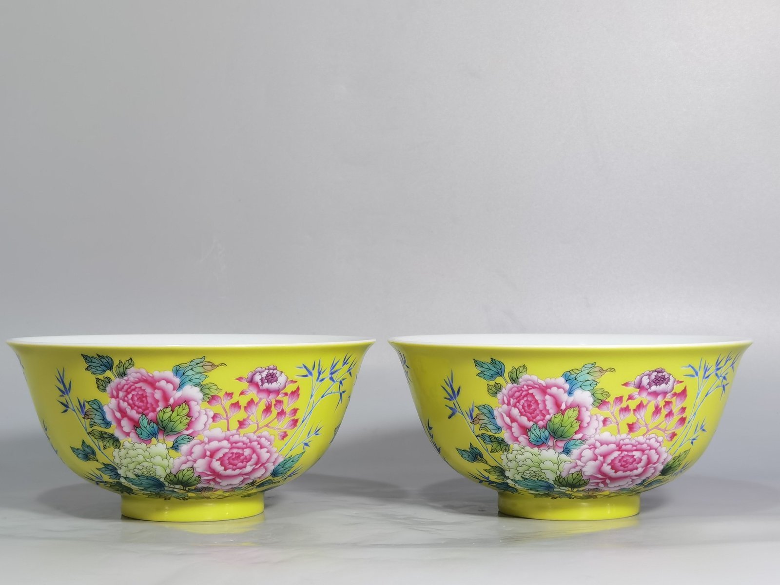 Qing Dynasty Qianlong enamel yellow ground peony and flower palace bowls