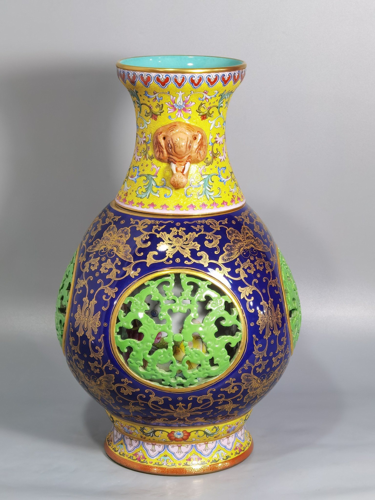 Qing Dynasty Qianlong hollow panchi pattern inner baryon elephant ear revolving bottle