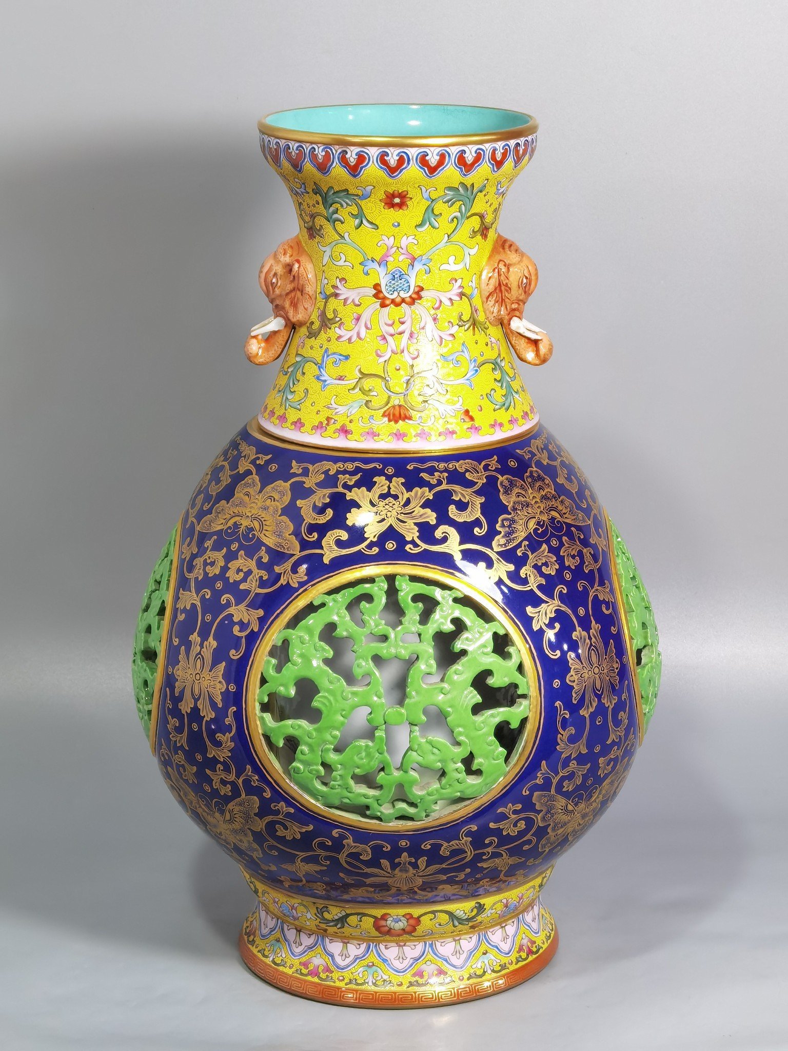 Qing Dynasty Qianlong hollow panchi pattern inner baryon elephant ear revolving bottle