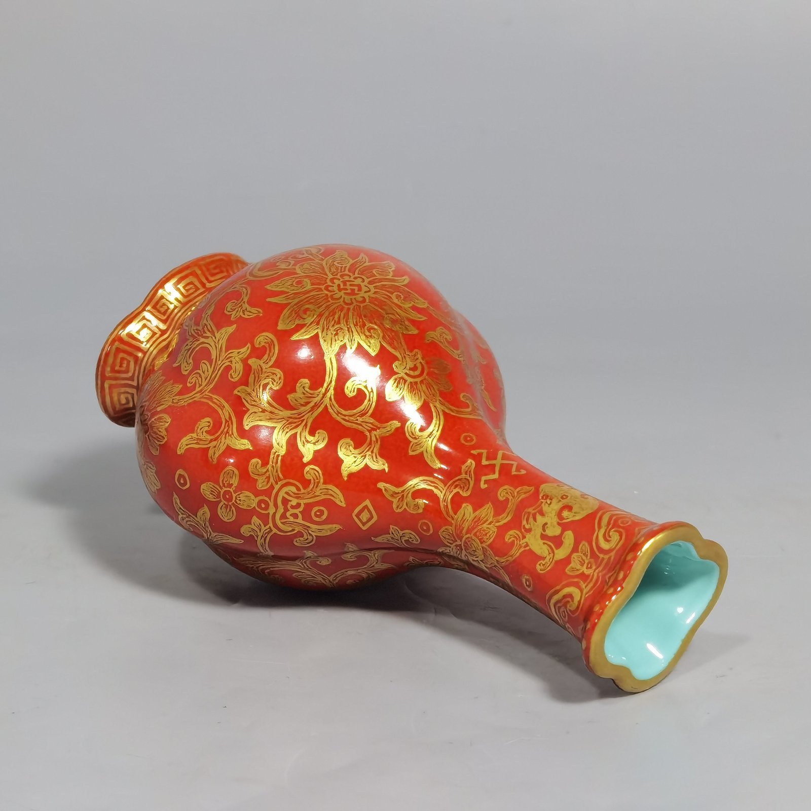 Qing Dynasty Qianlong small coral-red gold-painted Haitang vase