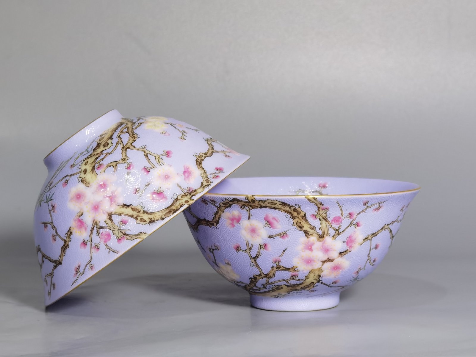 Qing Dynasty Qianlong pair of enamel-rolled plum blossom tea rounds