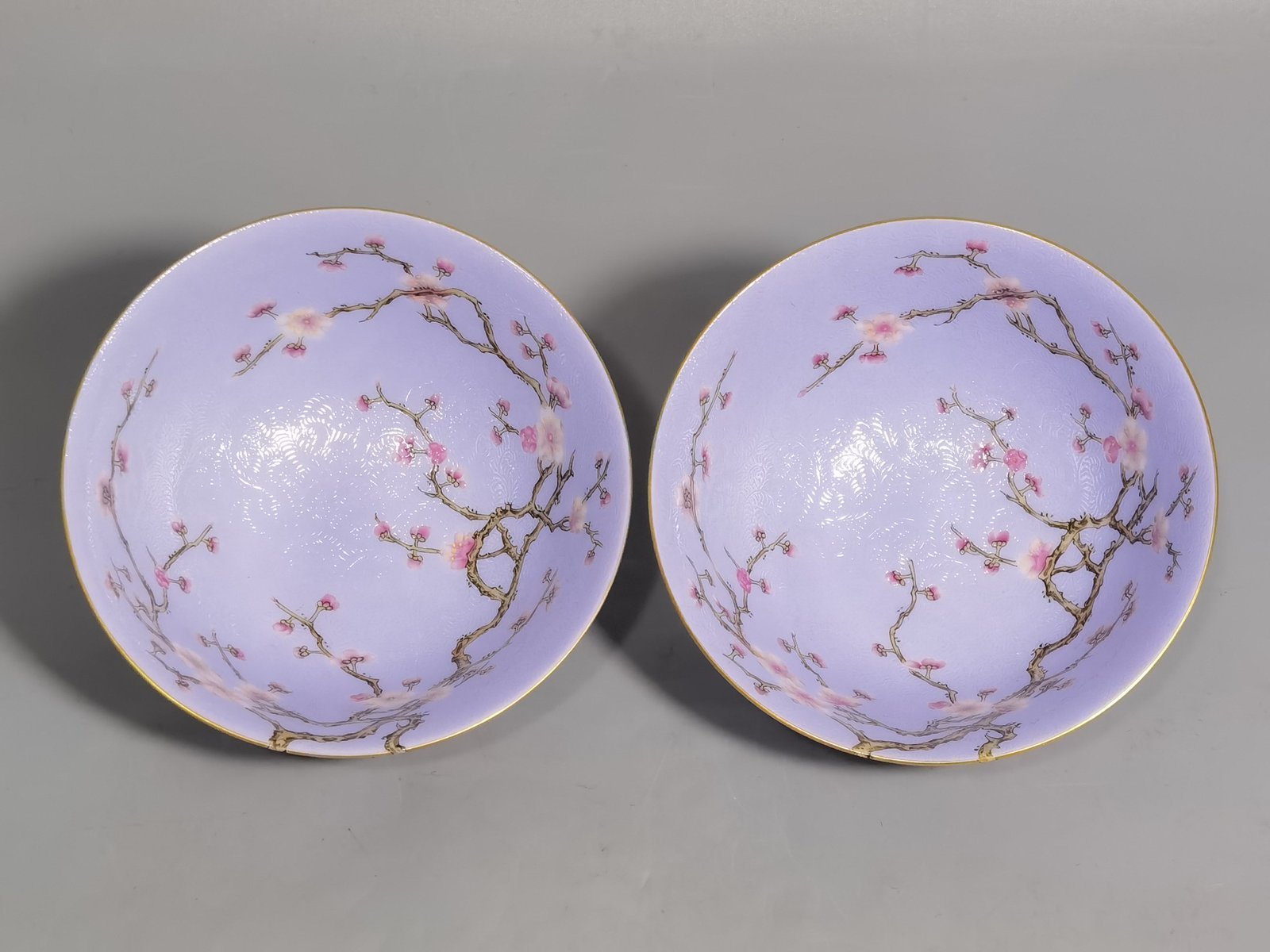 Qing Dynasty Qianlong pair of enamel-rolled plum blossom tea rounds