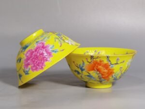 Qing Dynasty Qianlong pair of enamel-rolled peony and flower tea