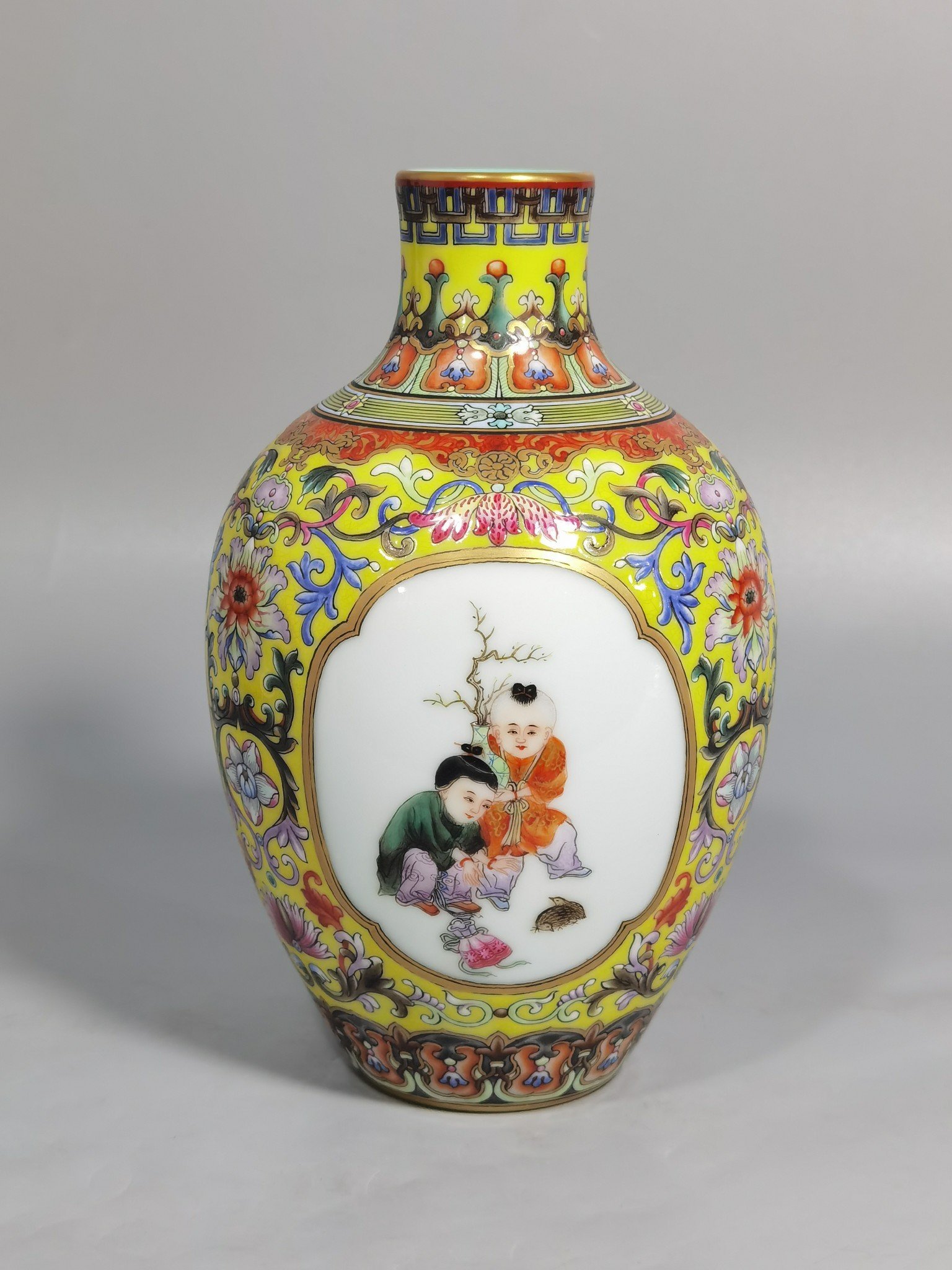 Qing Dynasty Qianlong enamel yellow ground consecrated baby play vase