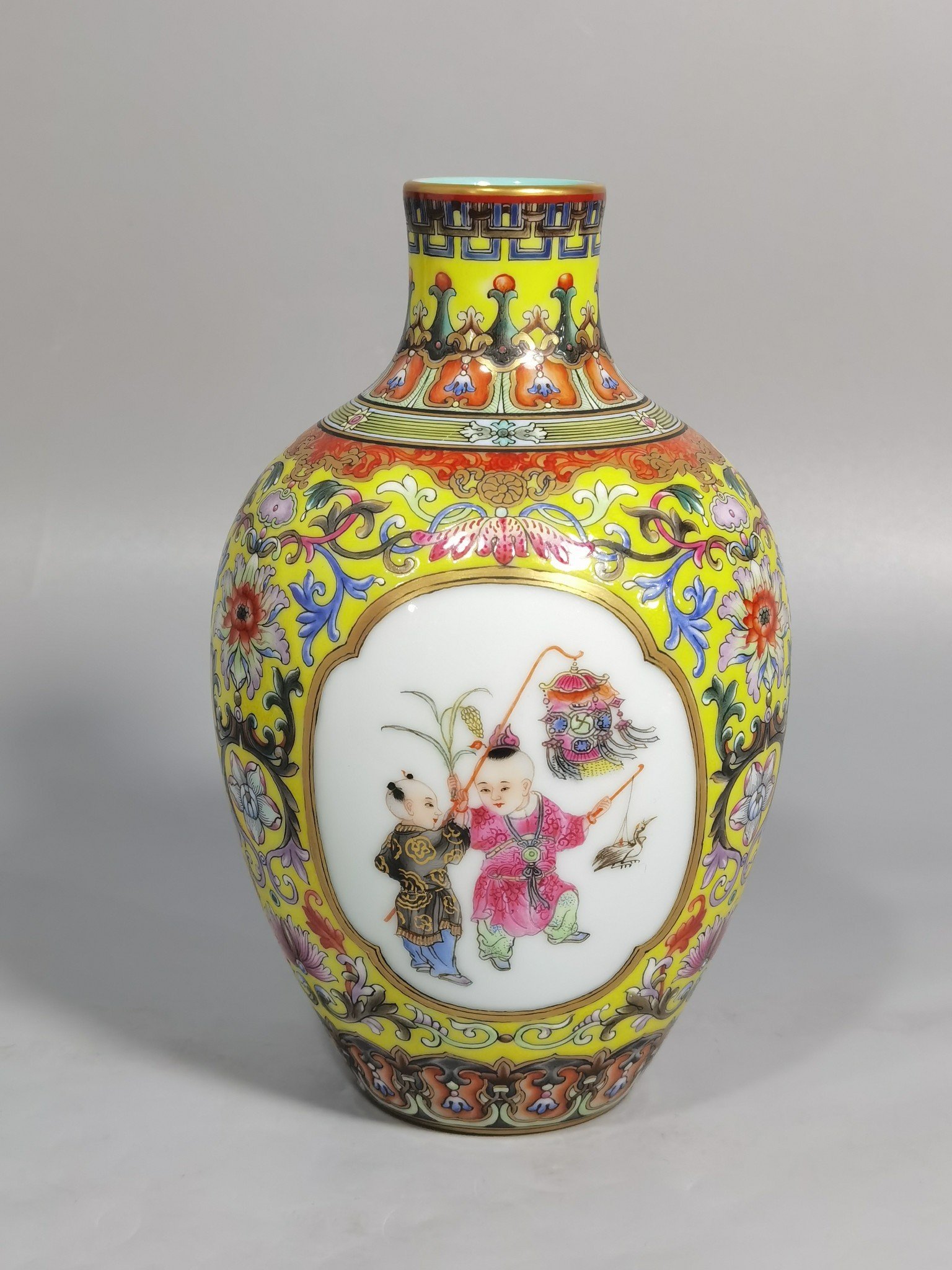 Qing Dynasty Qianlong enamel yellow ground consecrated baby play vase