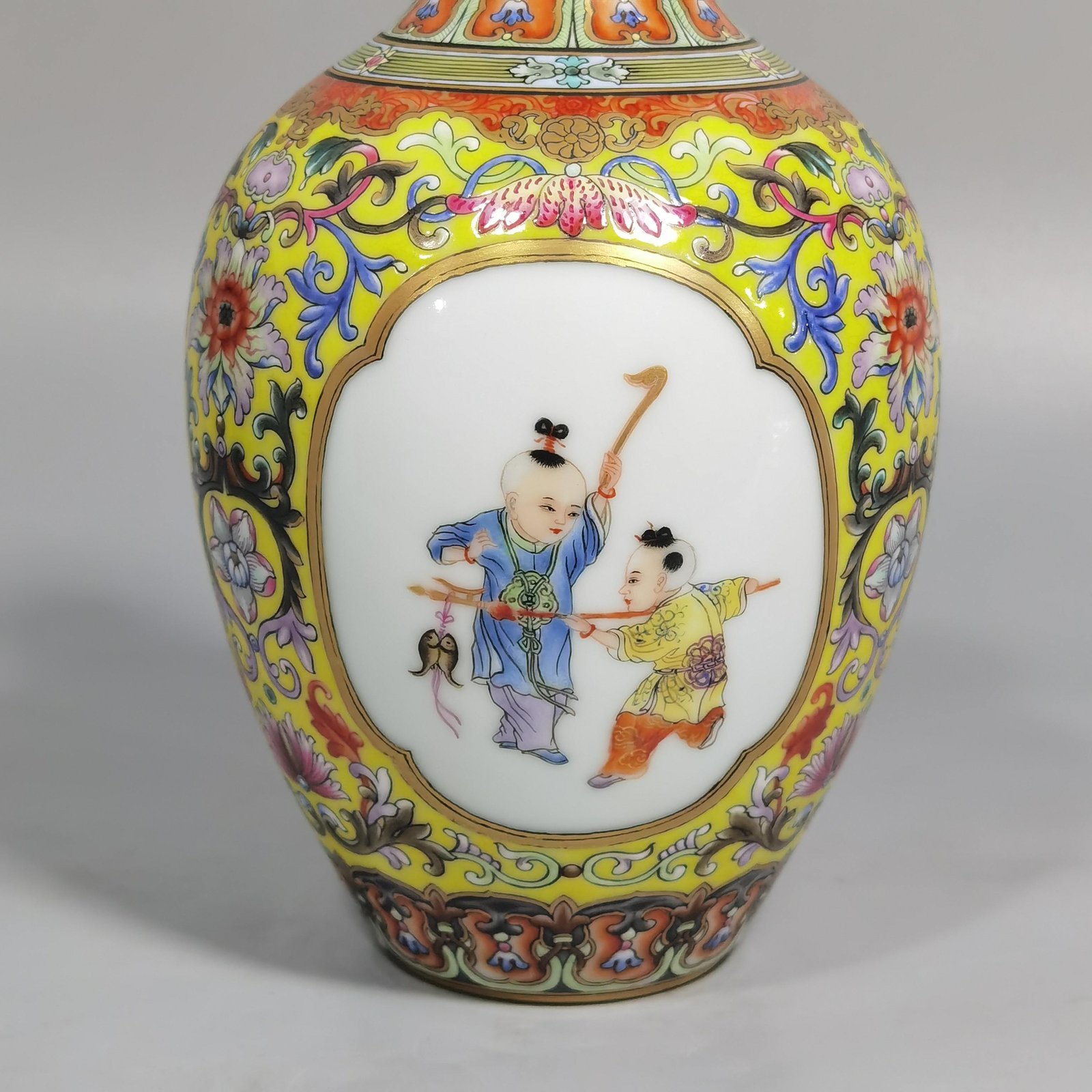 Qing Dynasty Qianlong enamel yellow ground consecrated baby play vase