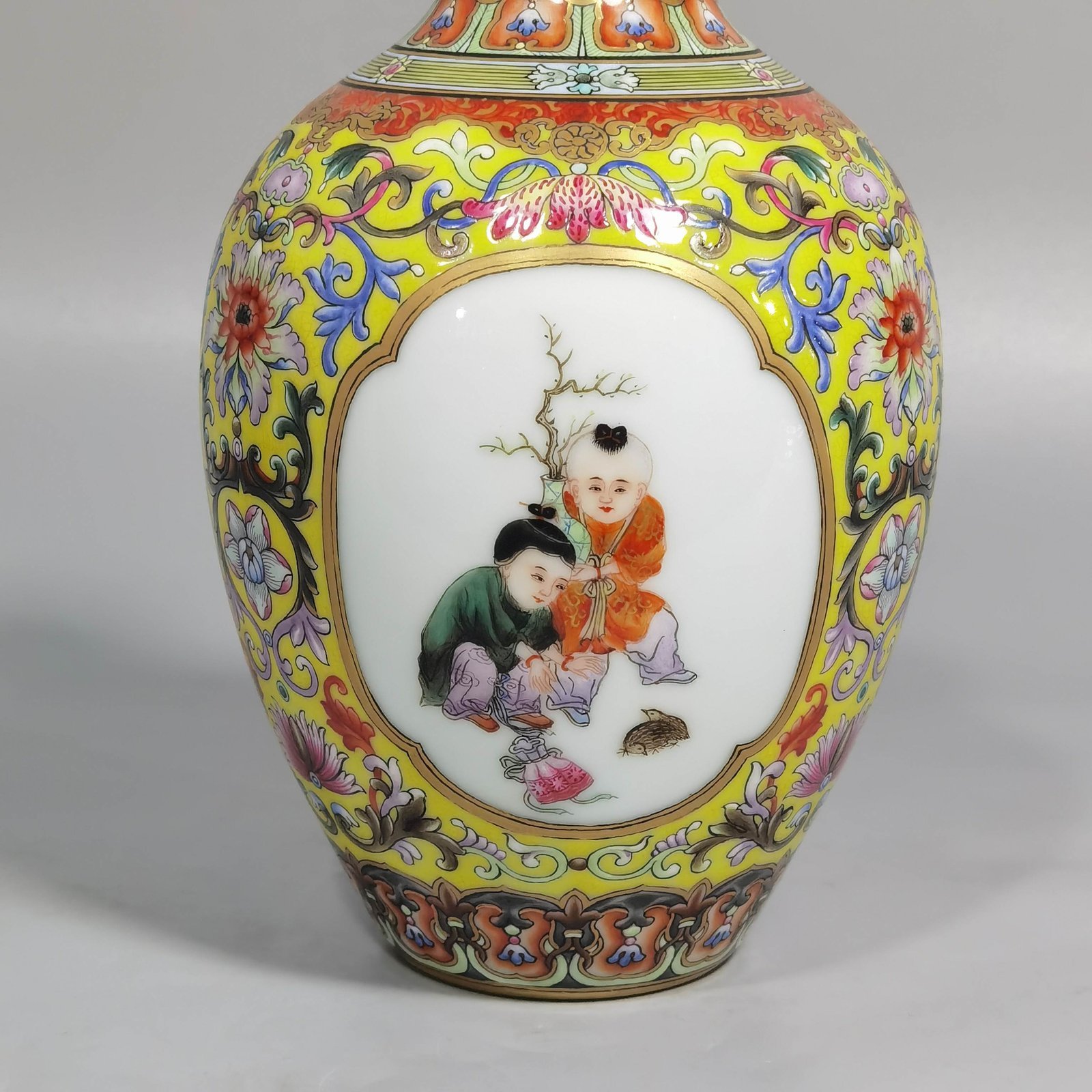 Qing Dynasty Qianlong enamel yellow ground consecrated baby play vase