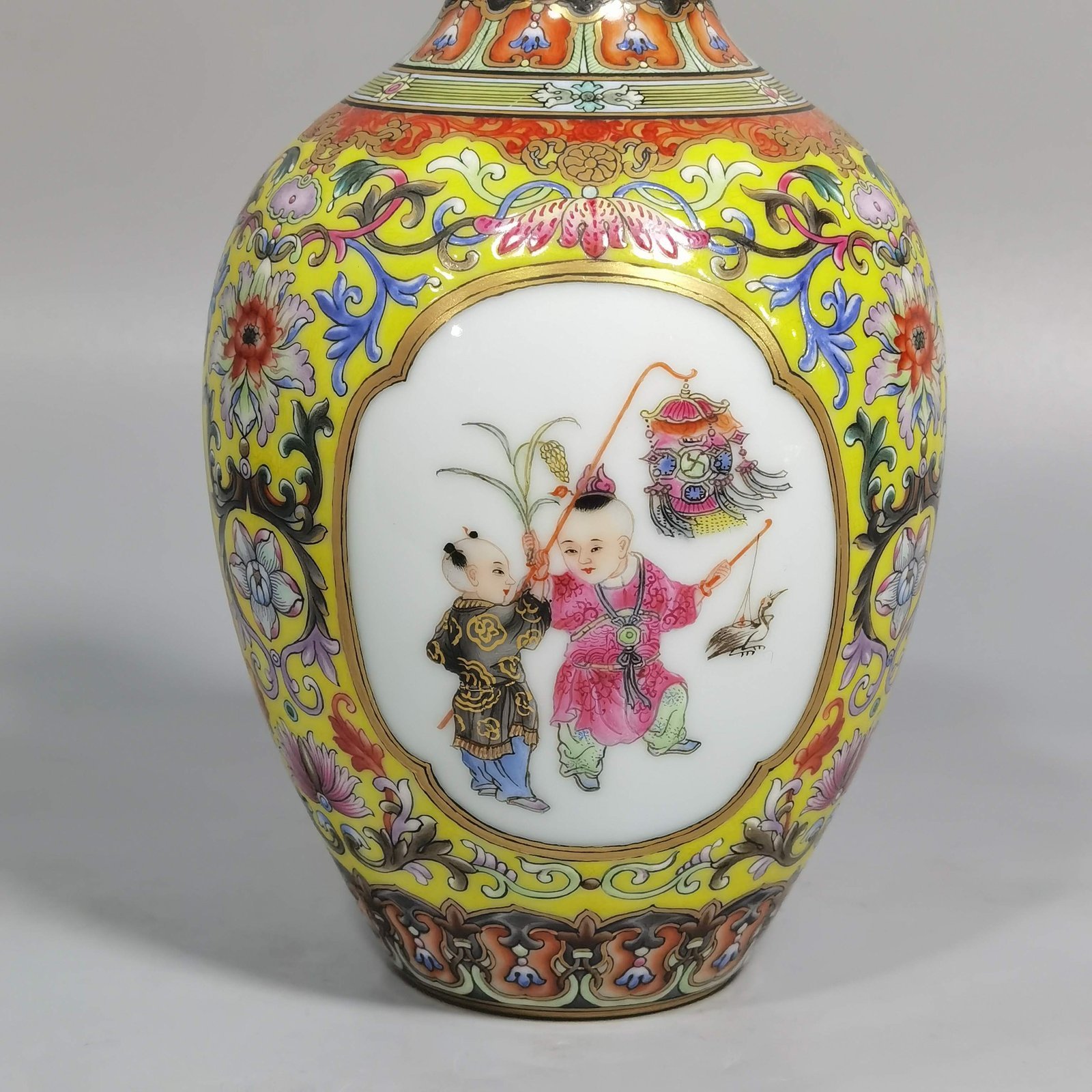 Qing Dynasty Qianlong enamel yellow ground consecrated baby play vase