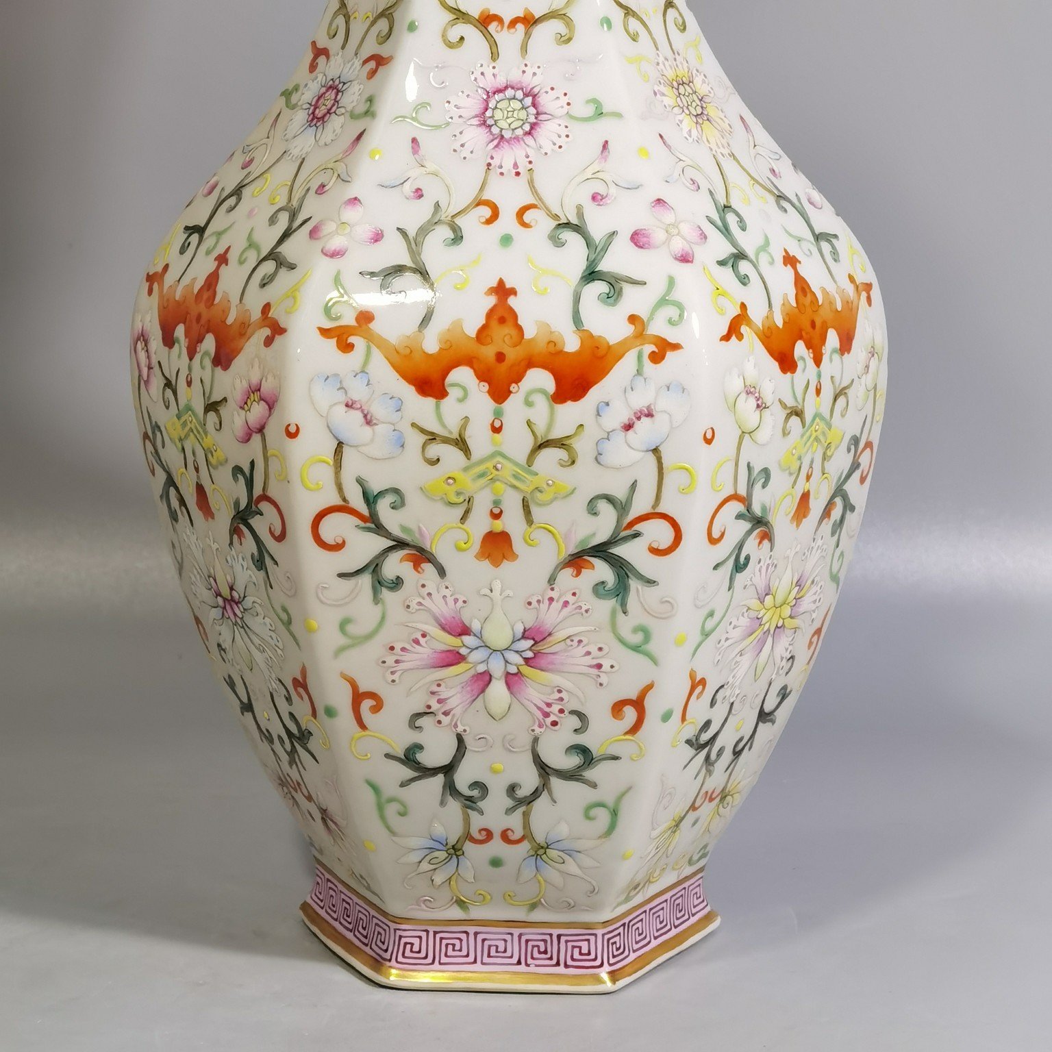 Qing Dynasty Qianlong pair of white-ground pastel-painted double-eared hexagonal vases