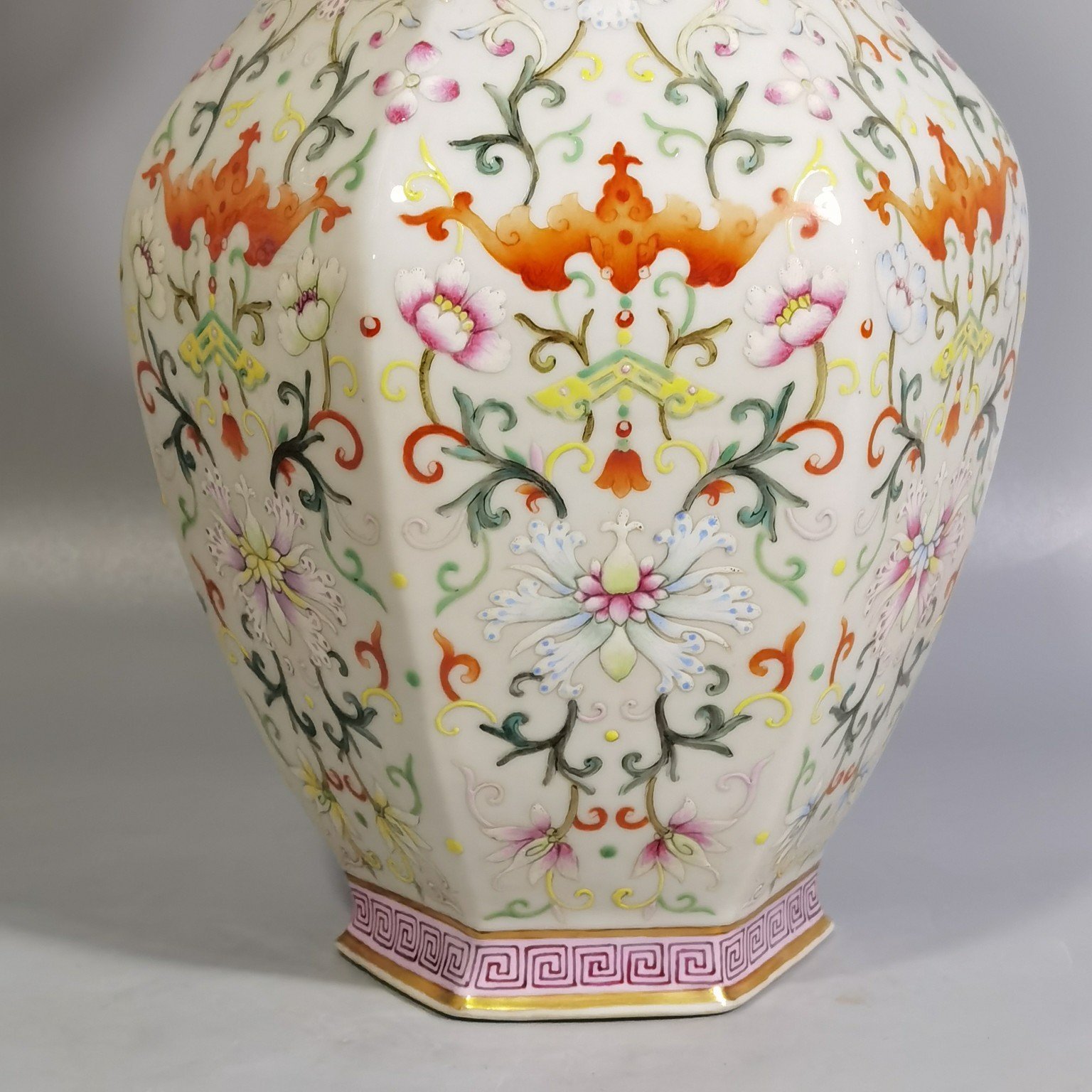 Qing Dynasty Qianlong pair of white-ground pastel-painted double-eared hexagonal vases