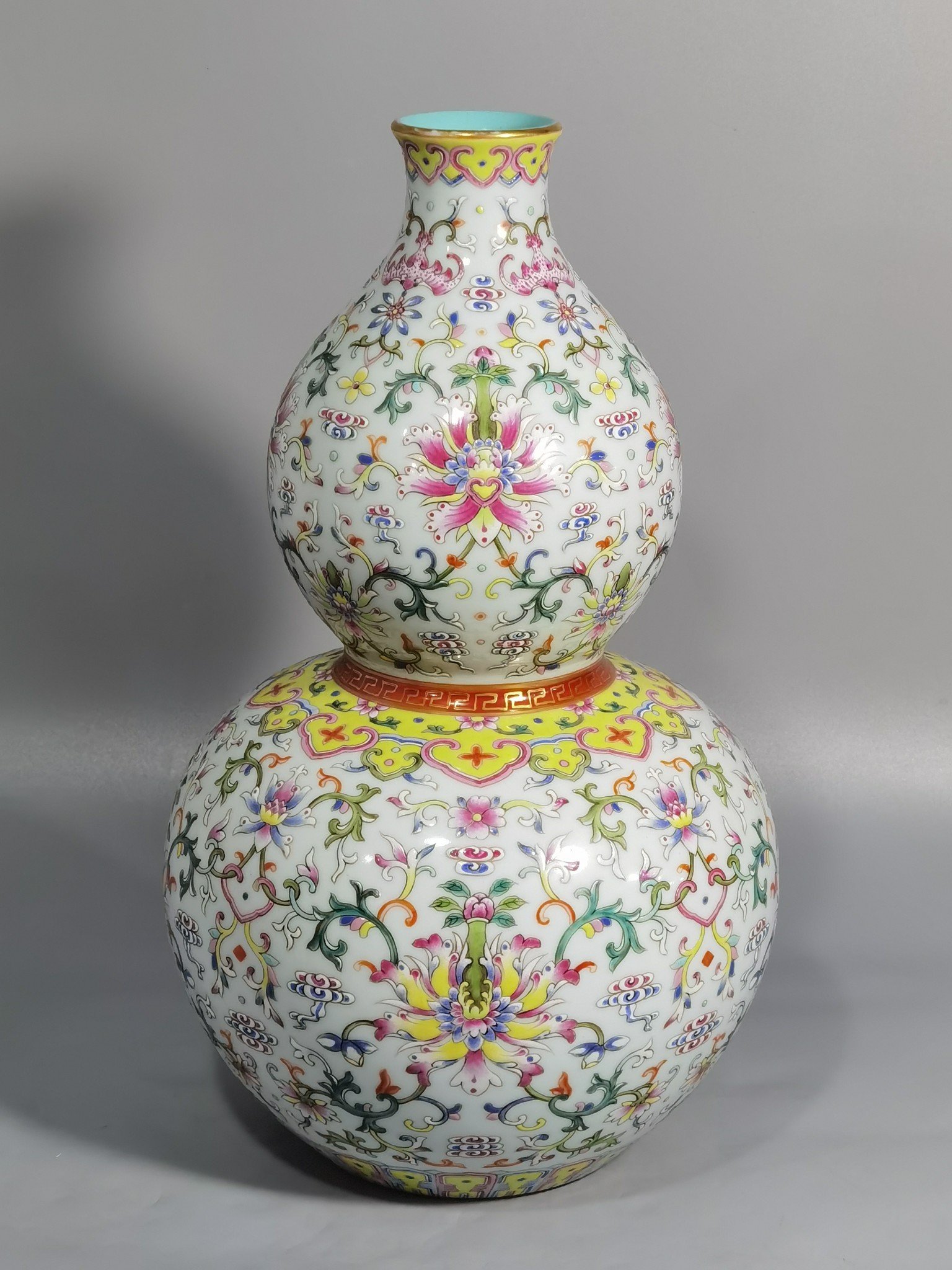 Qing Dynasty Qianlong white ground pastel-colored gourd vase