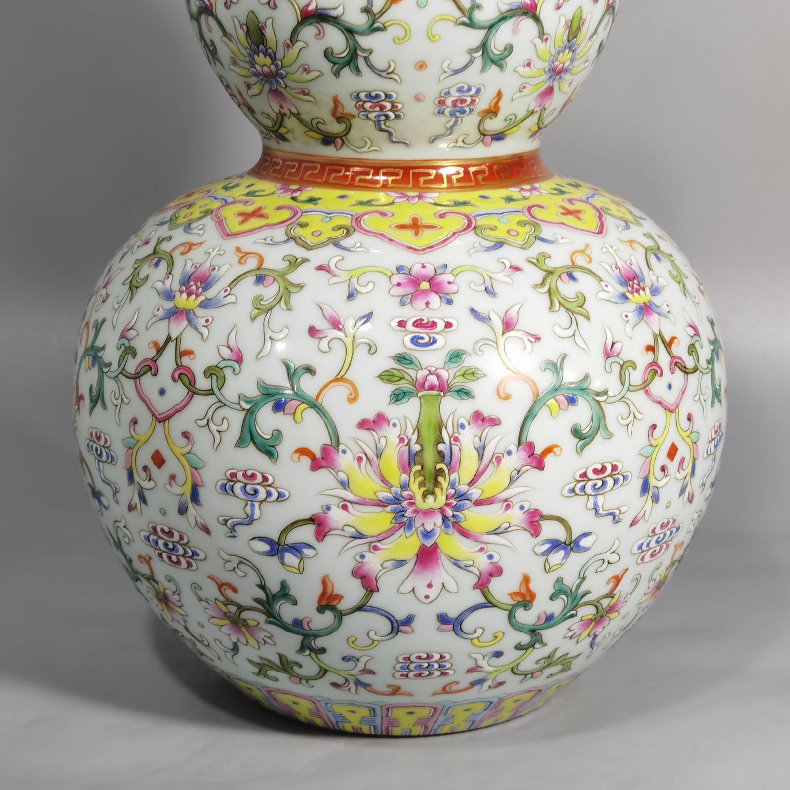 Qing Dynasty Qianlong white ground pastel-colored gourd vase