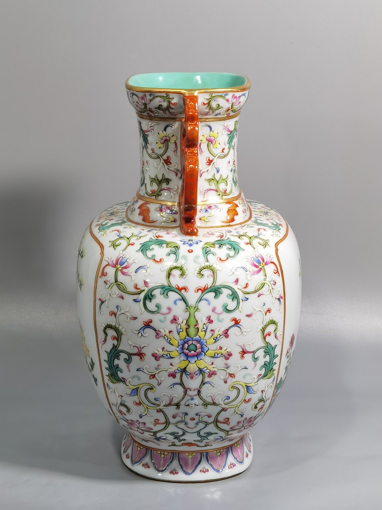 Qing Dynasty Qianlong white ground pastel lotus window flower double-eared flat vase