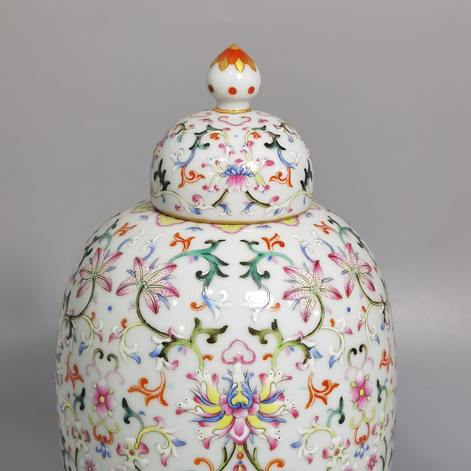 Qing Dynasty Qianlong white ground pastel colored lotus pattern covered jar