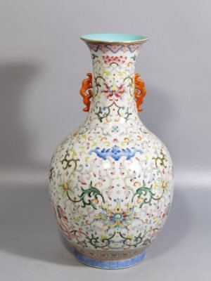 Qing Dynasty Qianlong white ground pastel red dragon pierced flower double-eared mouth-opening bottle