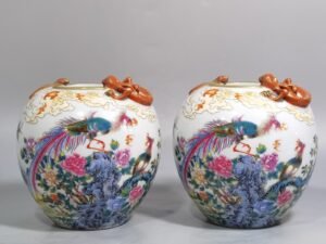 Qing Dynasty Qianlong pastel phoenix pierced through peonies vase