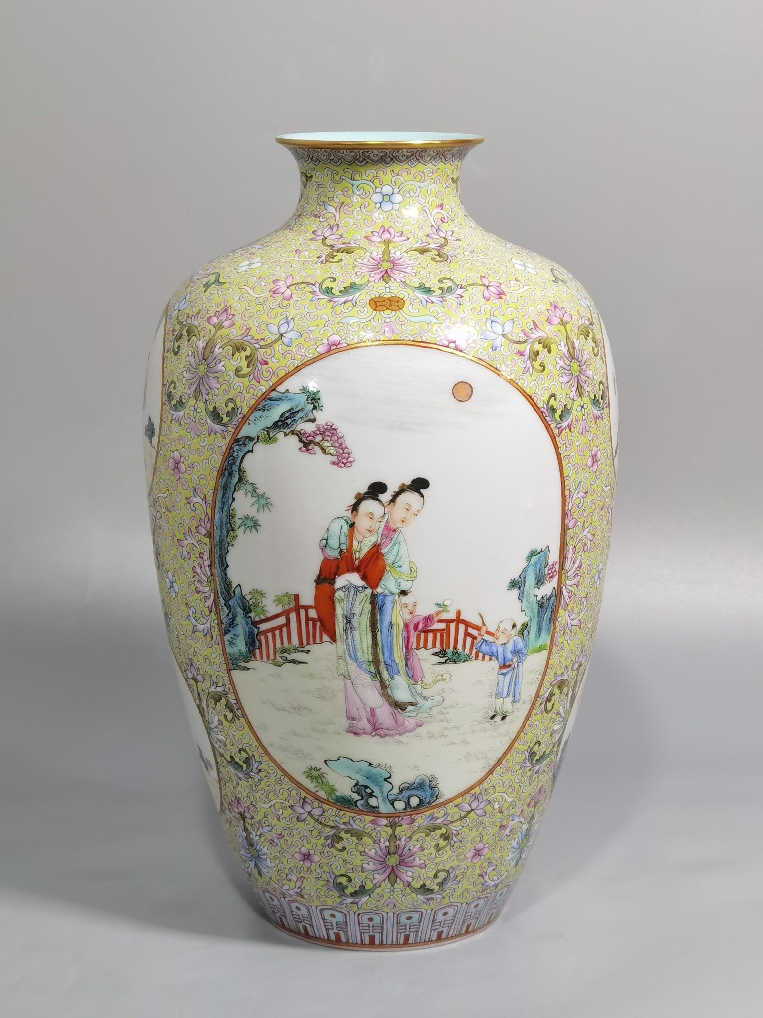 Qing Dynasty Qianlong pastel pine and green ground with intertwining lotus pattern plum vase