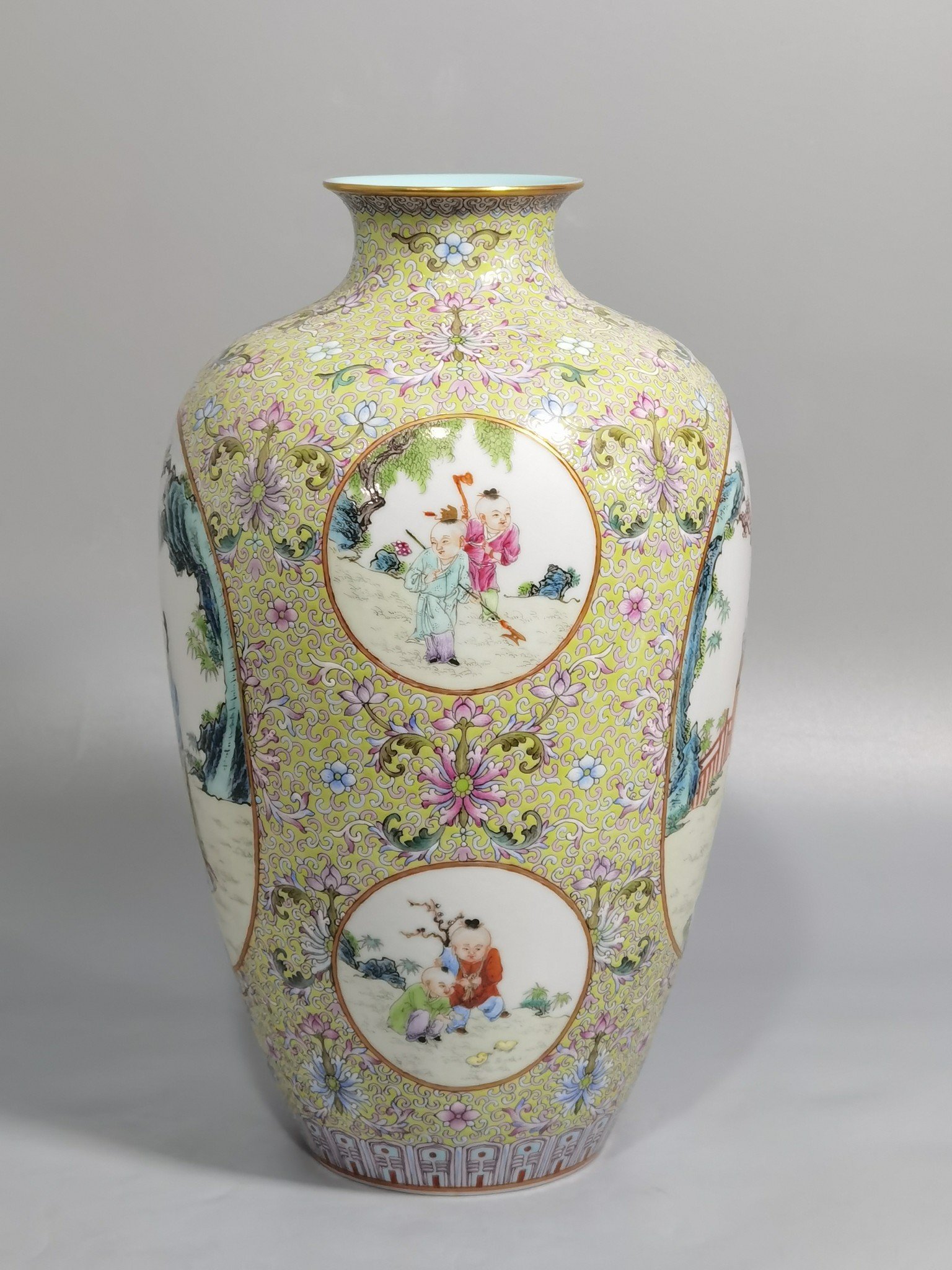 Qing Dynasty Qianlong pastel pine and green ground with intertwining lotus pattern plum vase