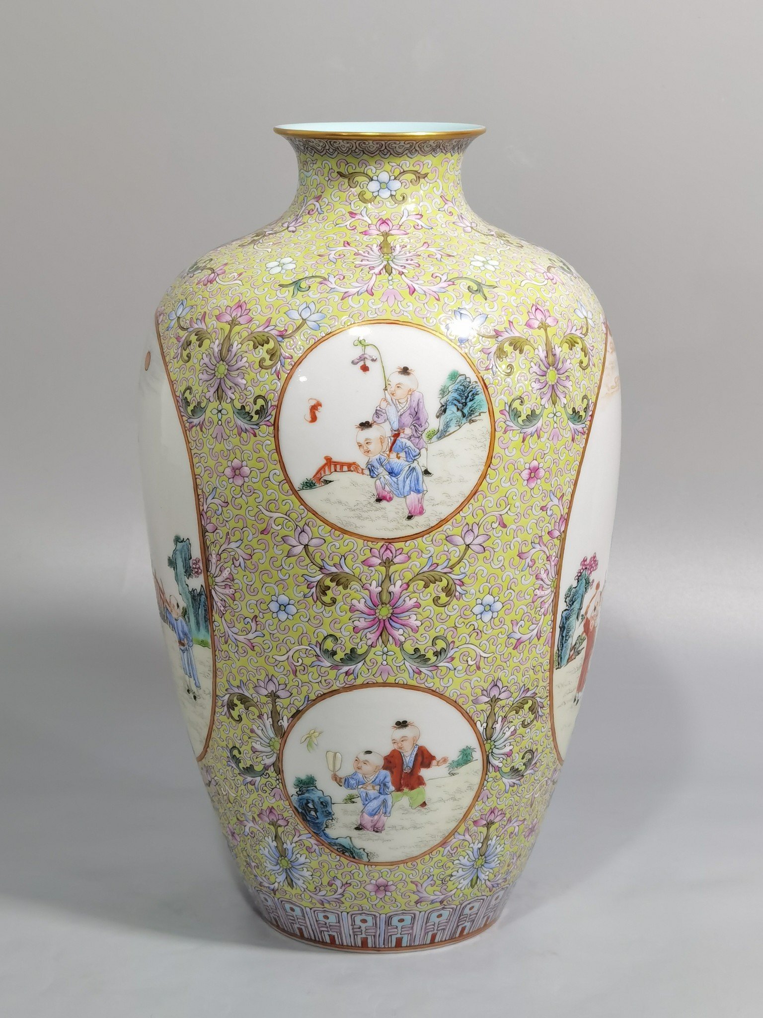 Qing Dynasty Qianlong pastel pine and green ground with intertwining lotus pattern plum vase