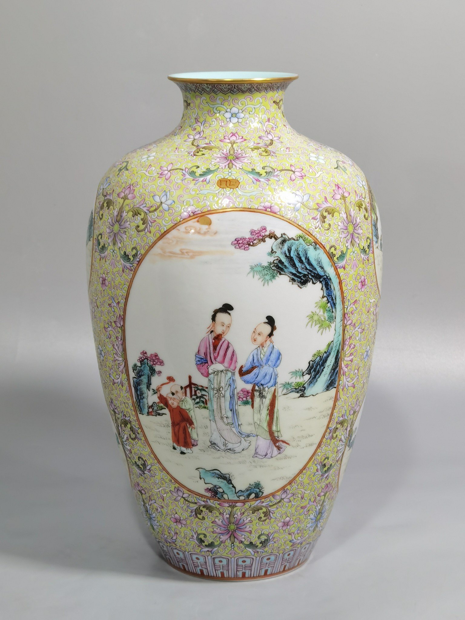 Qing Dynasty Qianlong pastel pine and green ground with intertwining lotus pattern plum vase