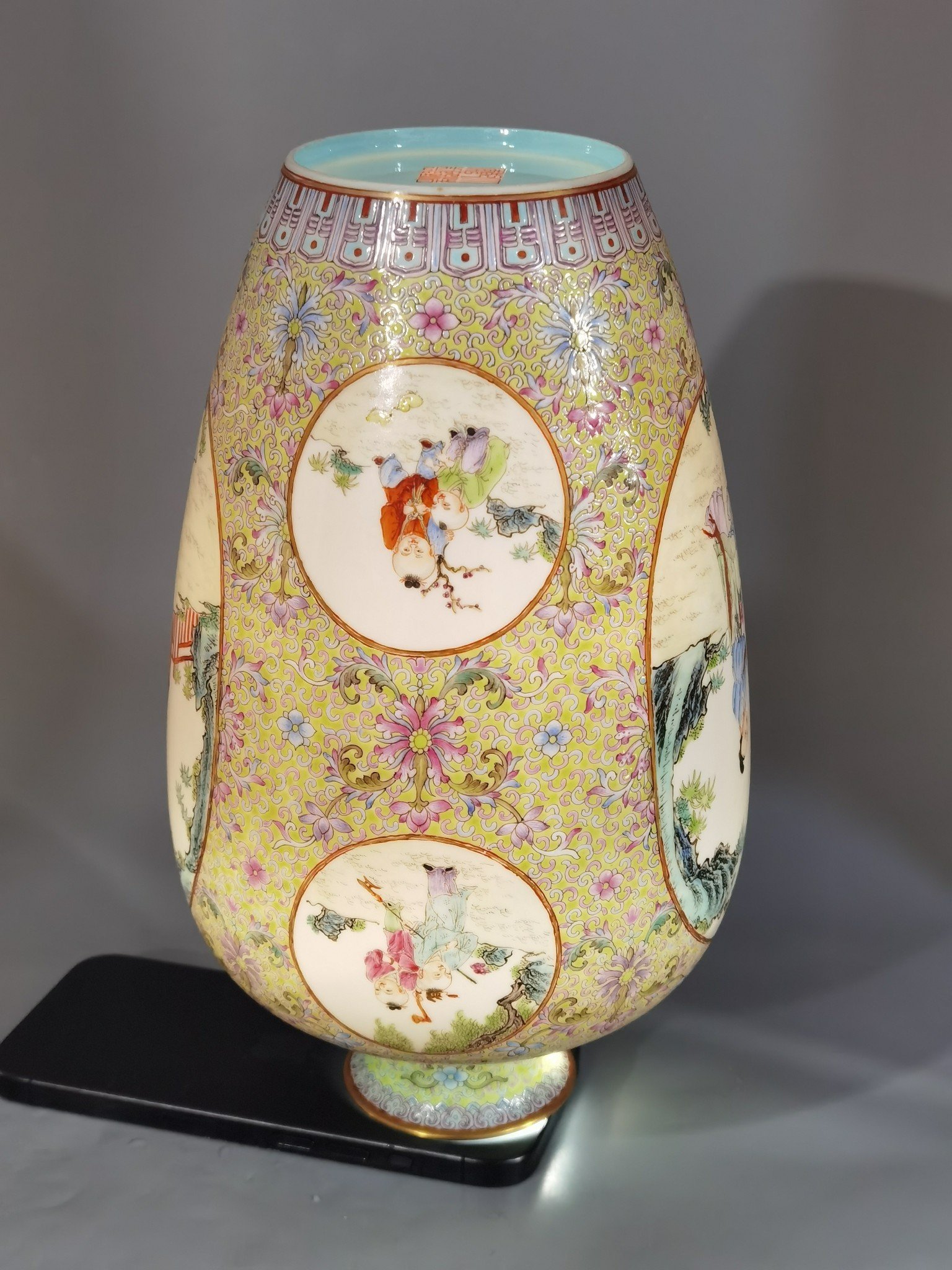 Qing Dynasty Qianlong pastel pine and green ground with intertwining lotus pattern plum vase