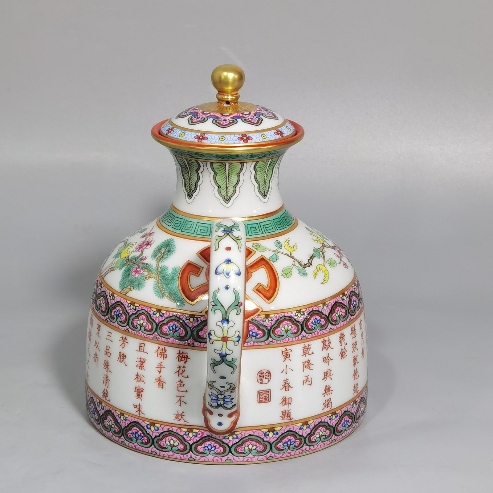 Qing Dynasty Qianlong pastel lum and red poems teapot