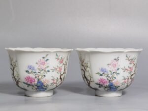 Qing Dynasty Qianlong pair of pastel flower Kuikou cups from the