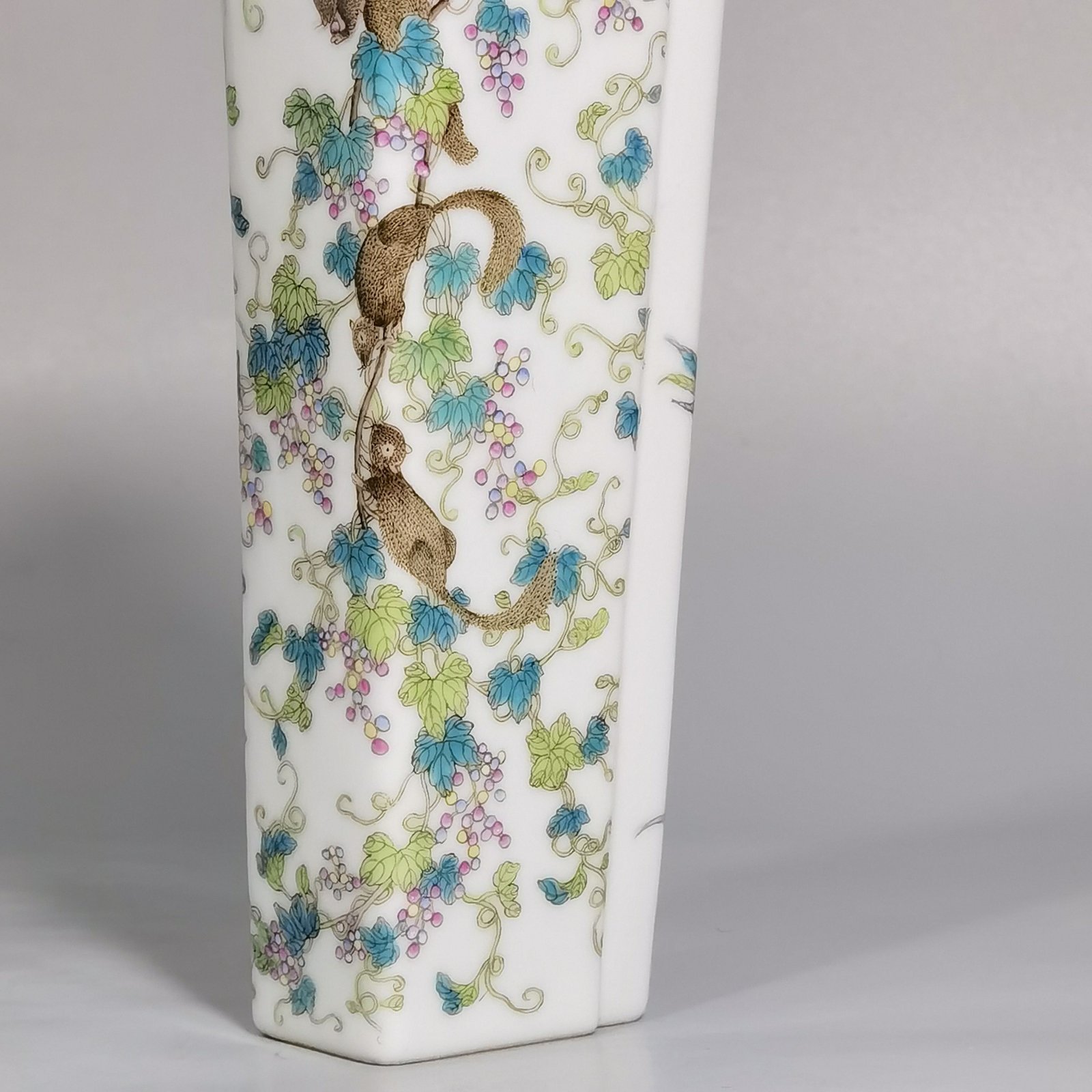 Qing Dynasty Qianlong pastel flower bird squirrel and grape pattern square bottle