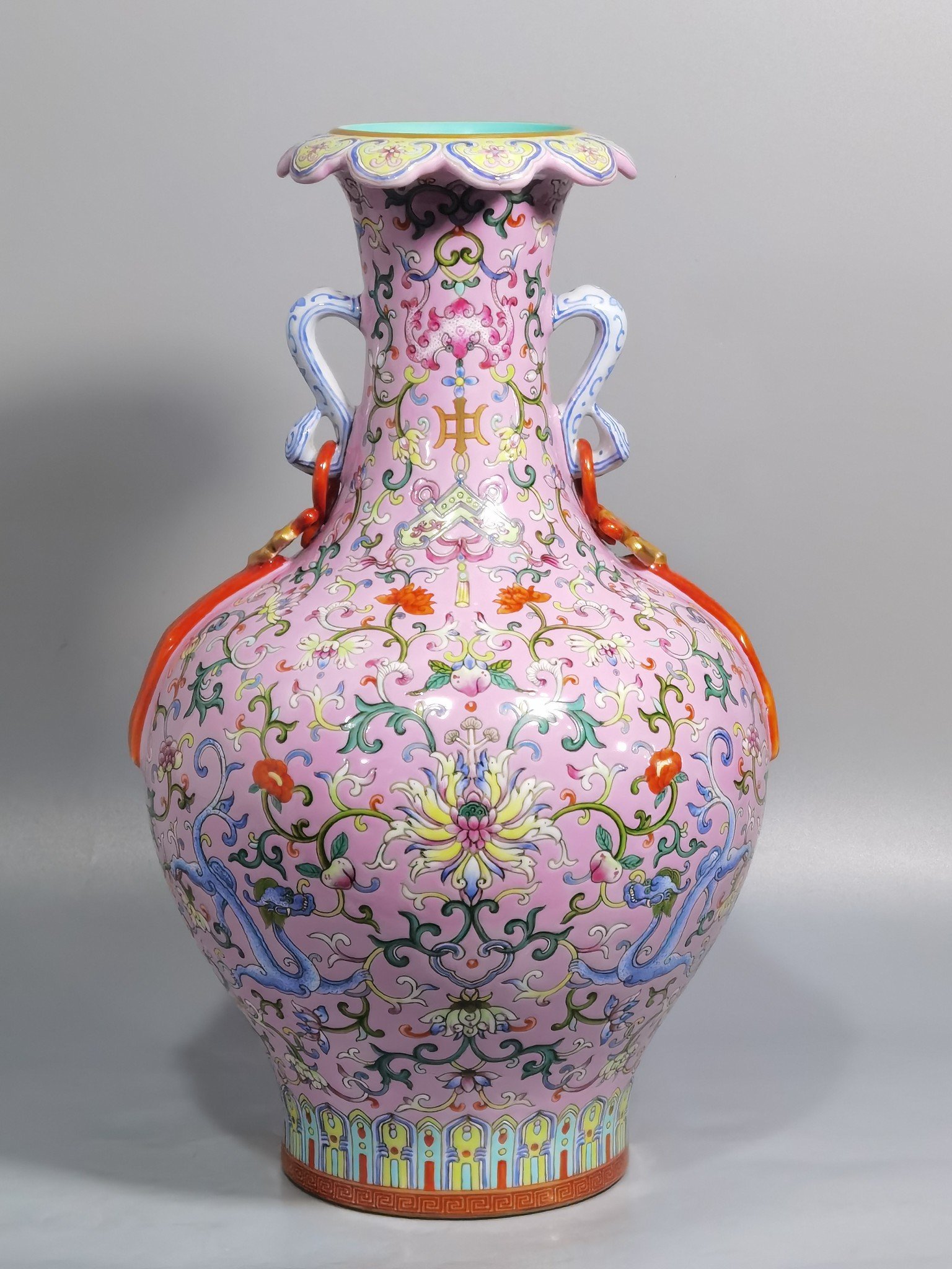 Qing Dynasty Qianlong pink ground pastel color Ruyi ear streamer flower mouth vase