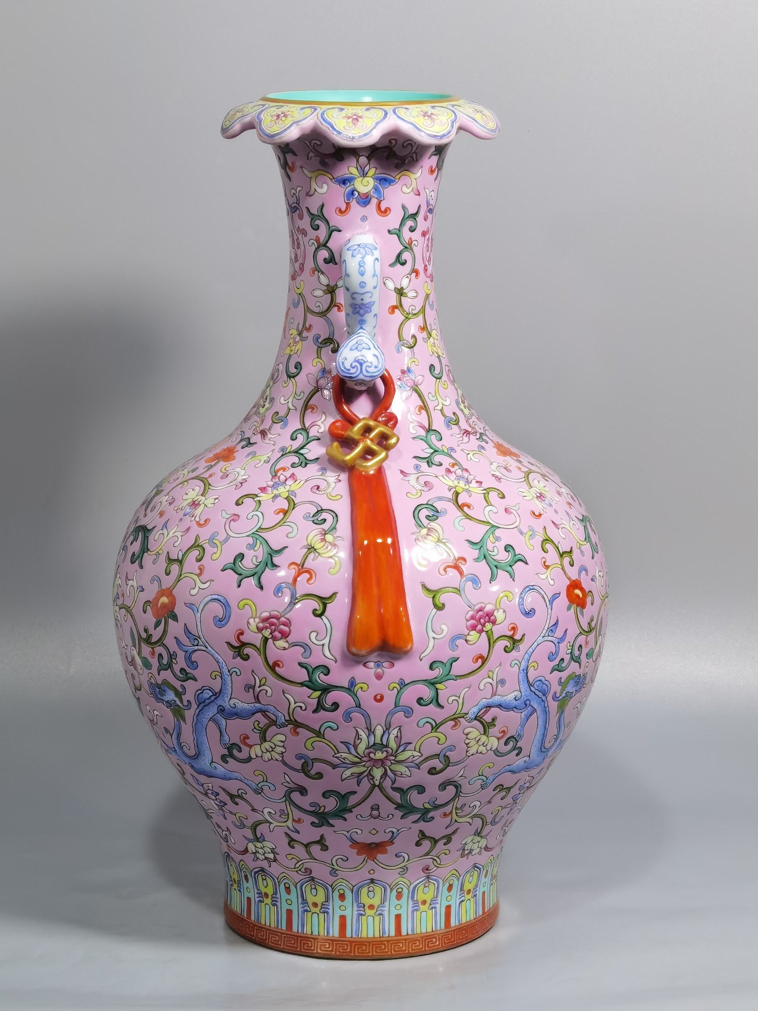 Qing Dynasty Qianlong pink ground pastel color Ruyi ear streamer flower mouth vase