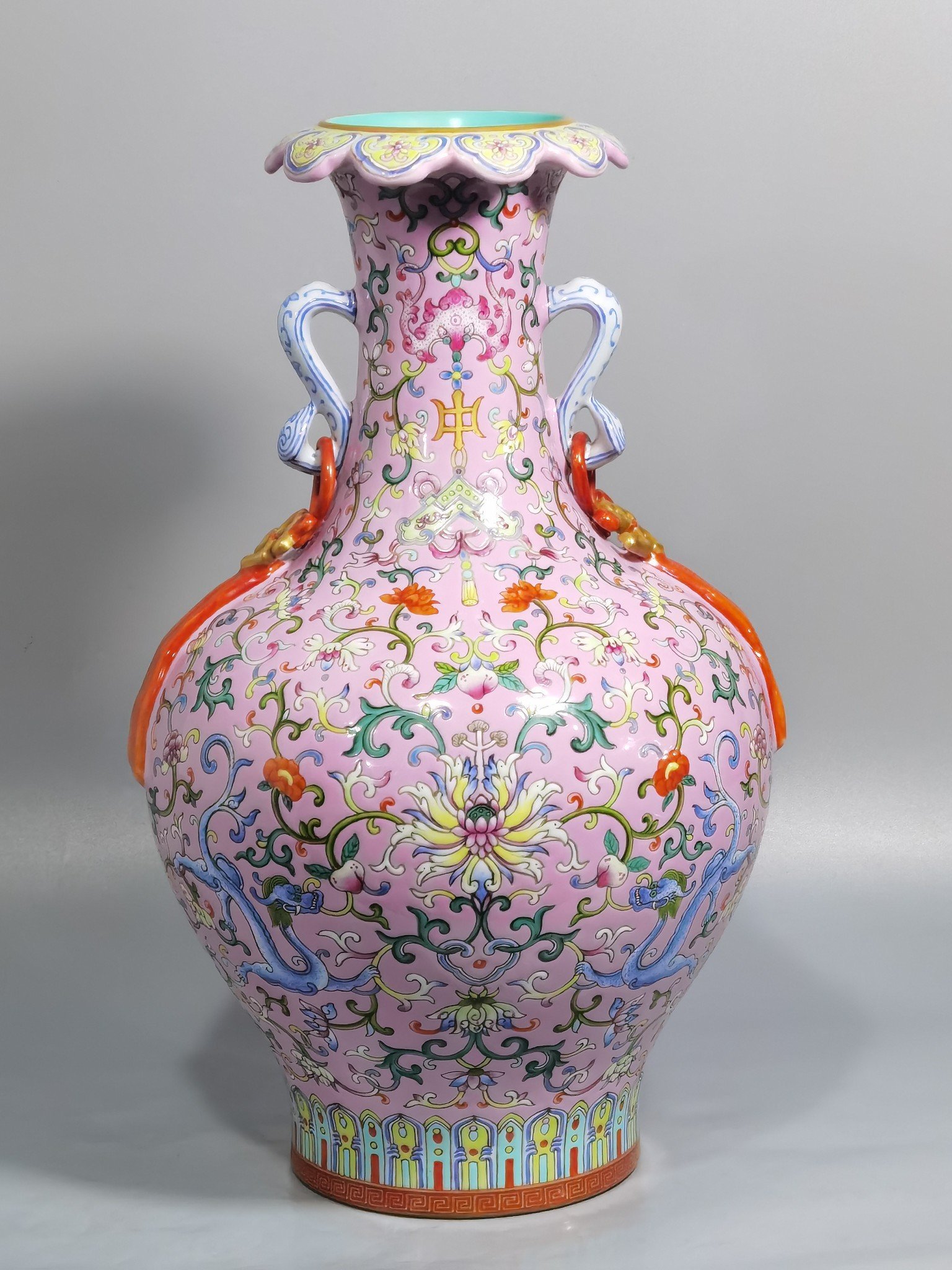 Qing Dynasty Qianlong pink ground pastel color Ruyi ear streamer flower mouth vase