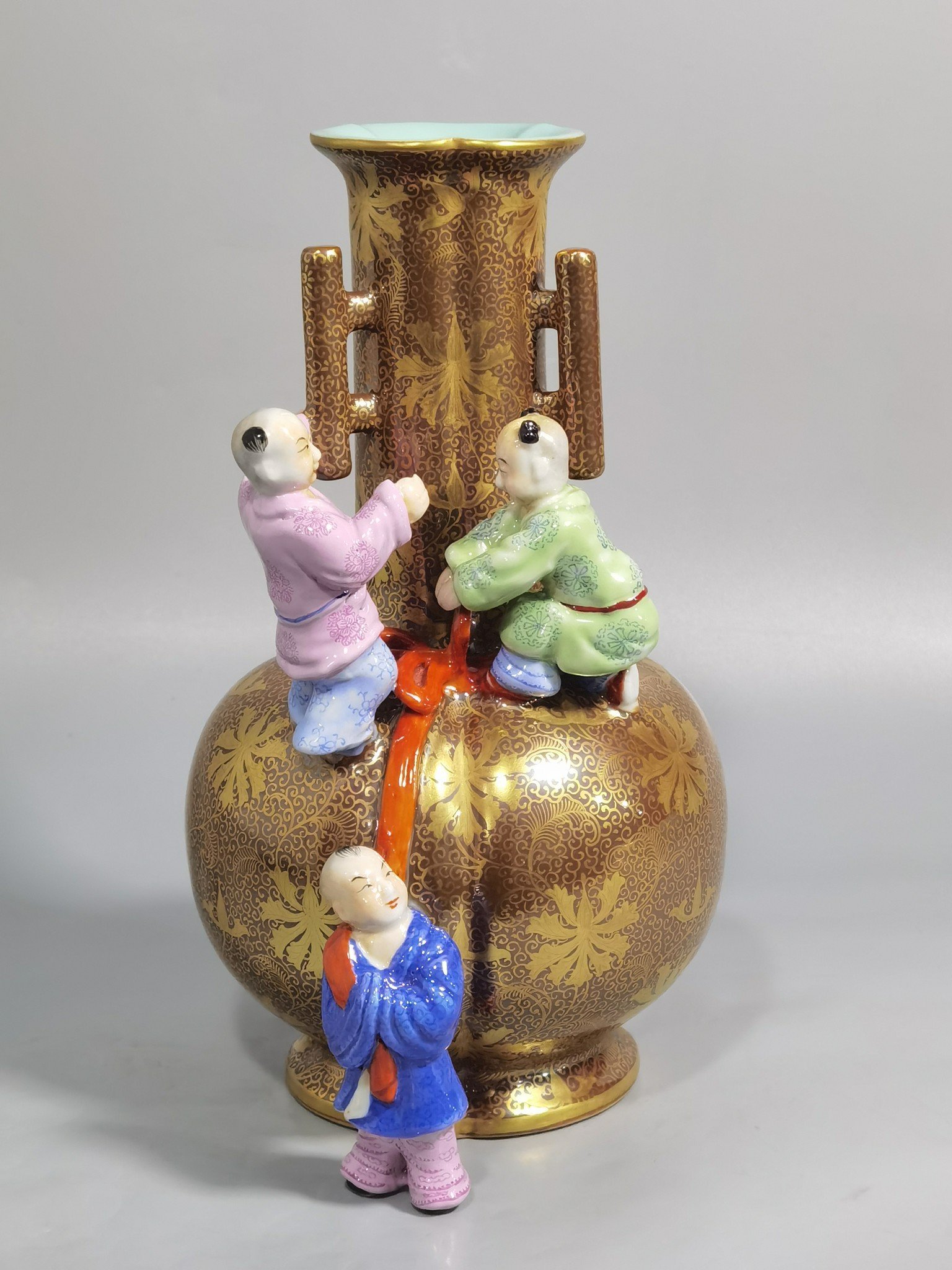 Qing Dynasty Qianlong purple gold glaze and gold pastel three-eared boy’s vase