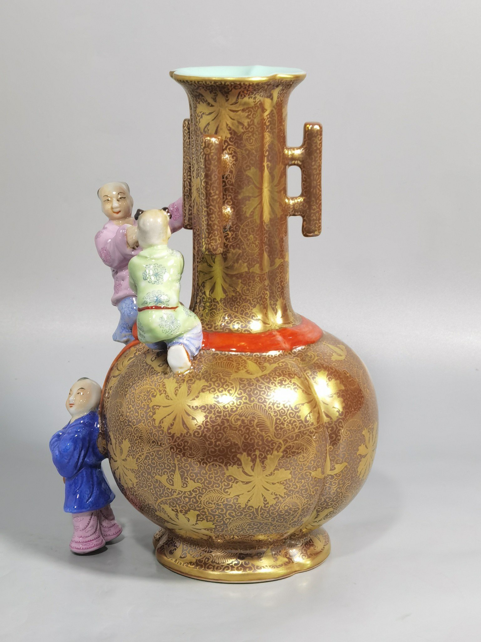 Qing Dynasty Qianlong purple gold glaze and gold pastel three-eared boy’s vase