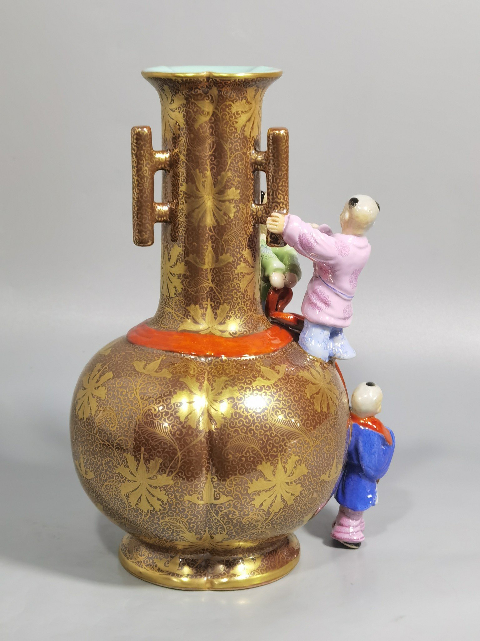 Qing Dynasty Qianlong purple gold glaze and gold pastel three-eared boy’s vase