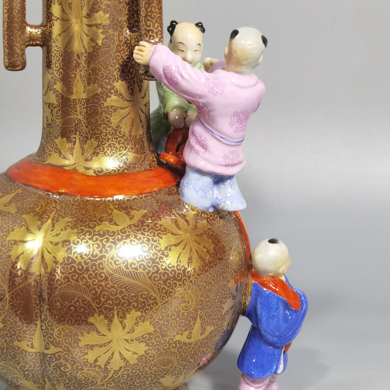 Qing Dynasty Qianlong purple gold glaze and gold pastel three-eared boy’s vase