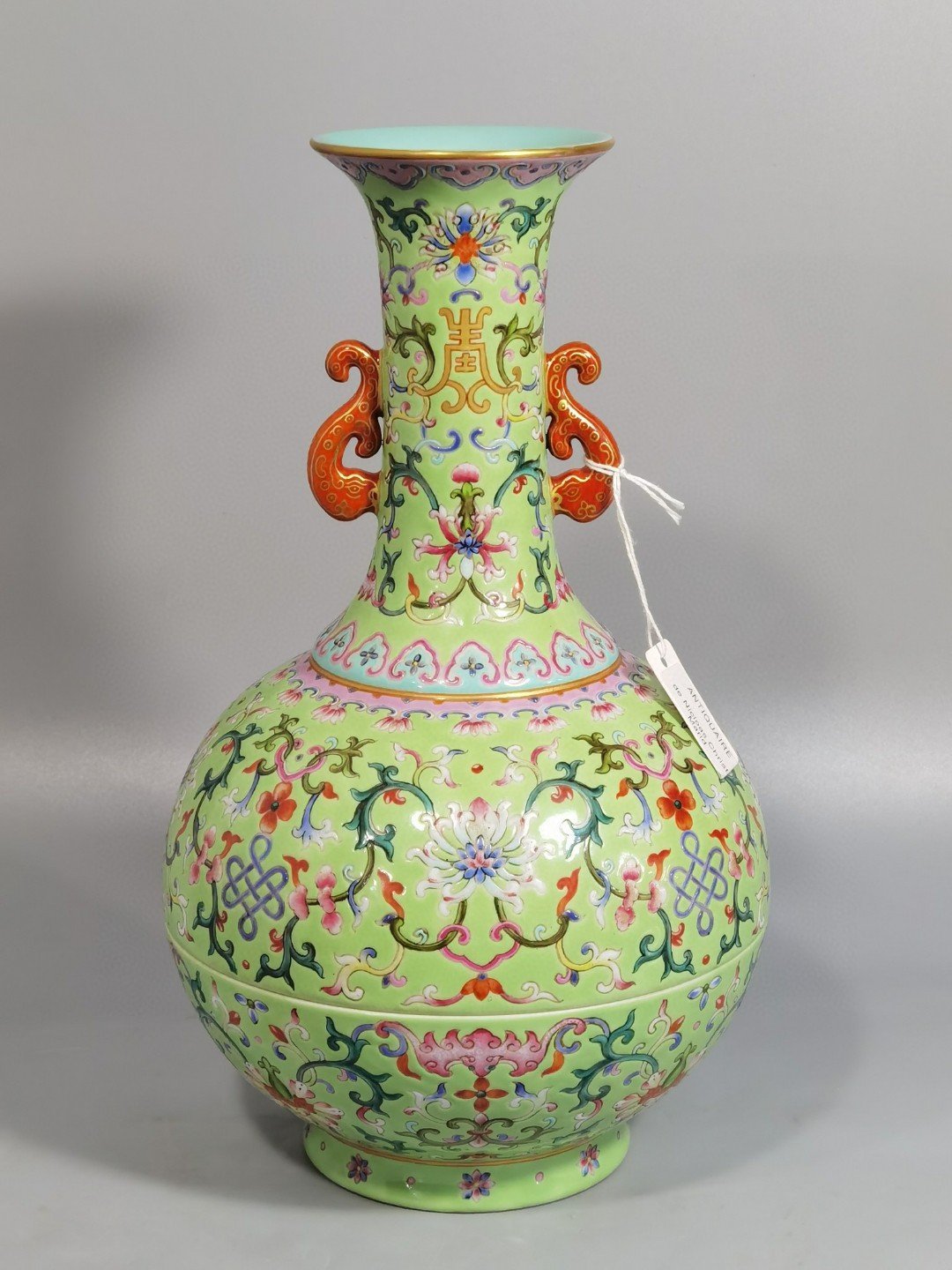 Qing Dynasty Qianlong green and pastel color double-ear capped bottle
