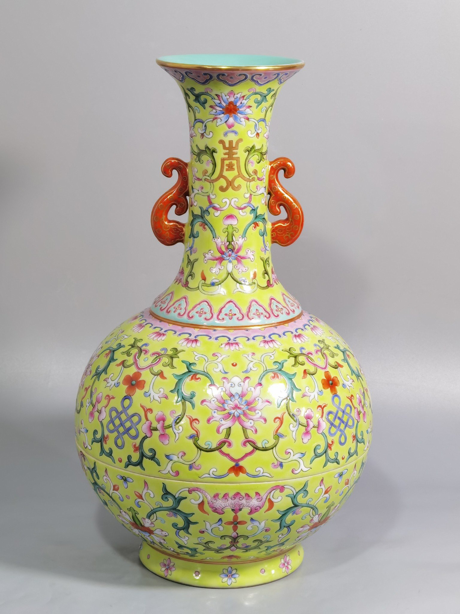 Qing Dynasty Qianlong green and pastel color double-ear capped bottle