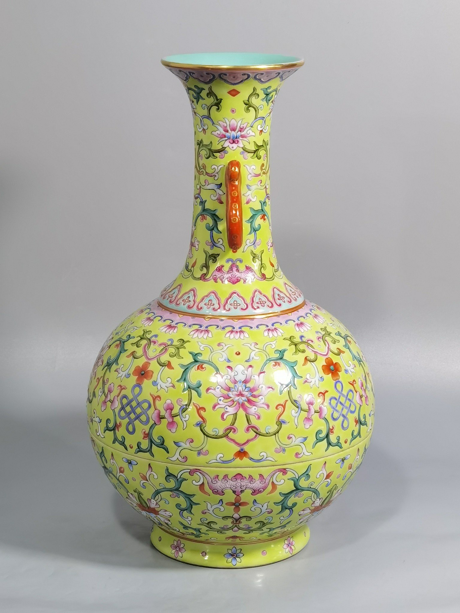 Qing Dynasty Qianlong green and pastel color double-ear capped bottle