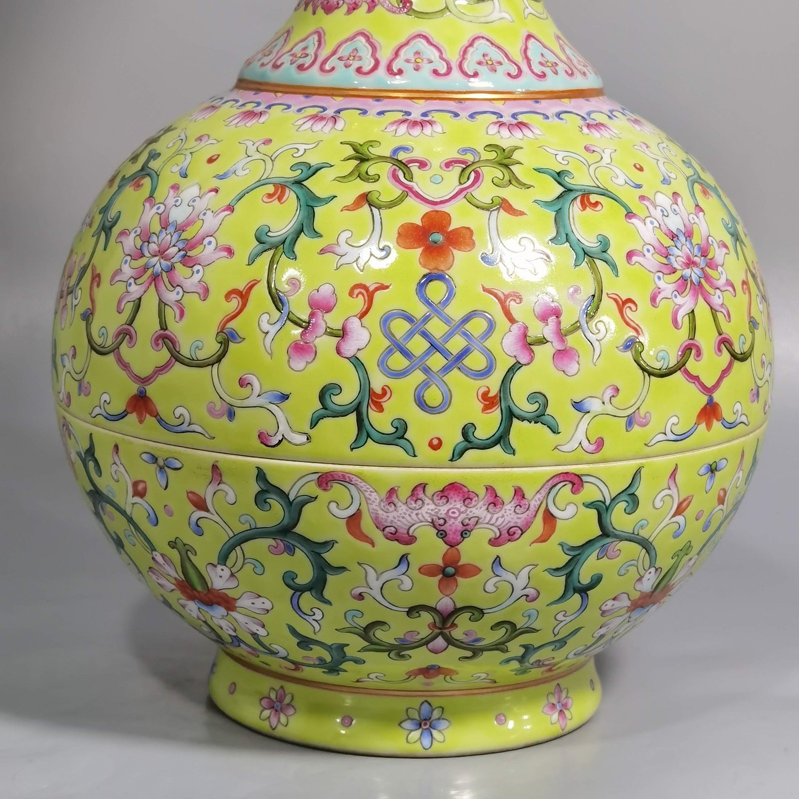 Qing Dynasty Qianlong green and pastel color double-ear capped bottle