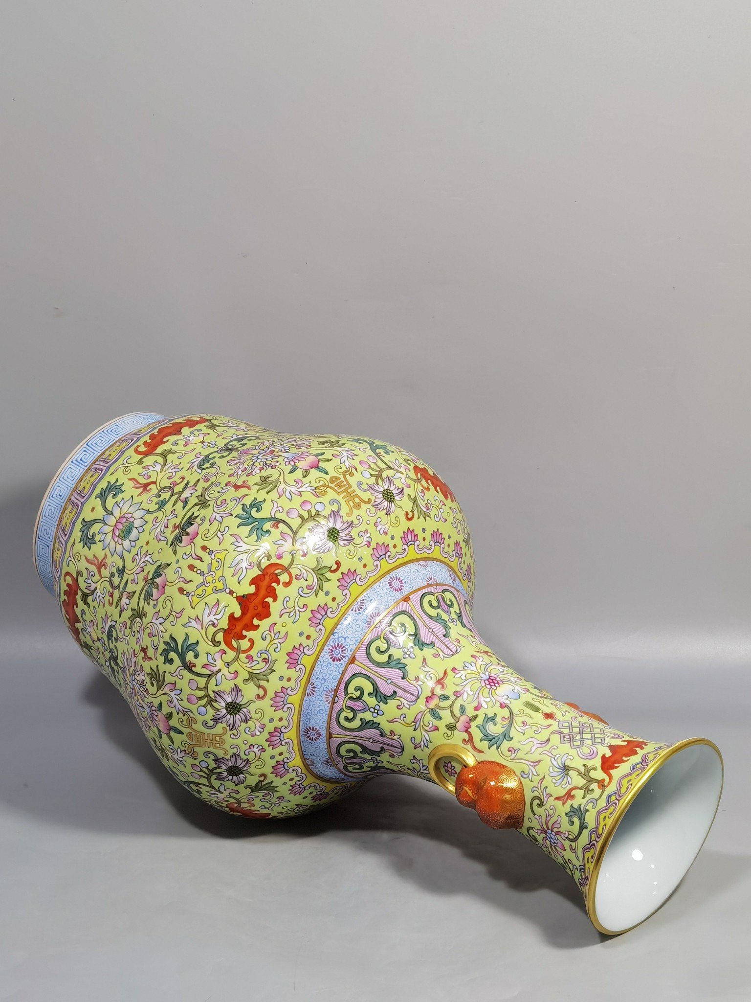 Qing Dynasty Qianlong green and pastel lotus and nimal ears skimming bottle