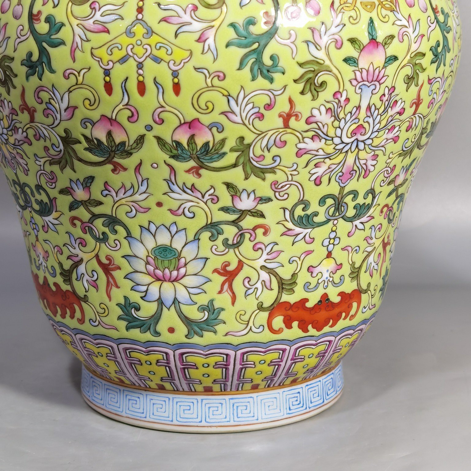 Qing Dynasty Qianlong green and pastel lotus and nimal ears skimming bottle
